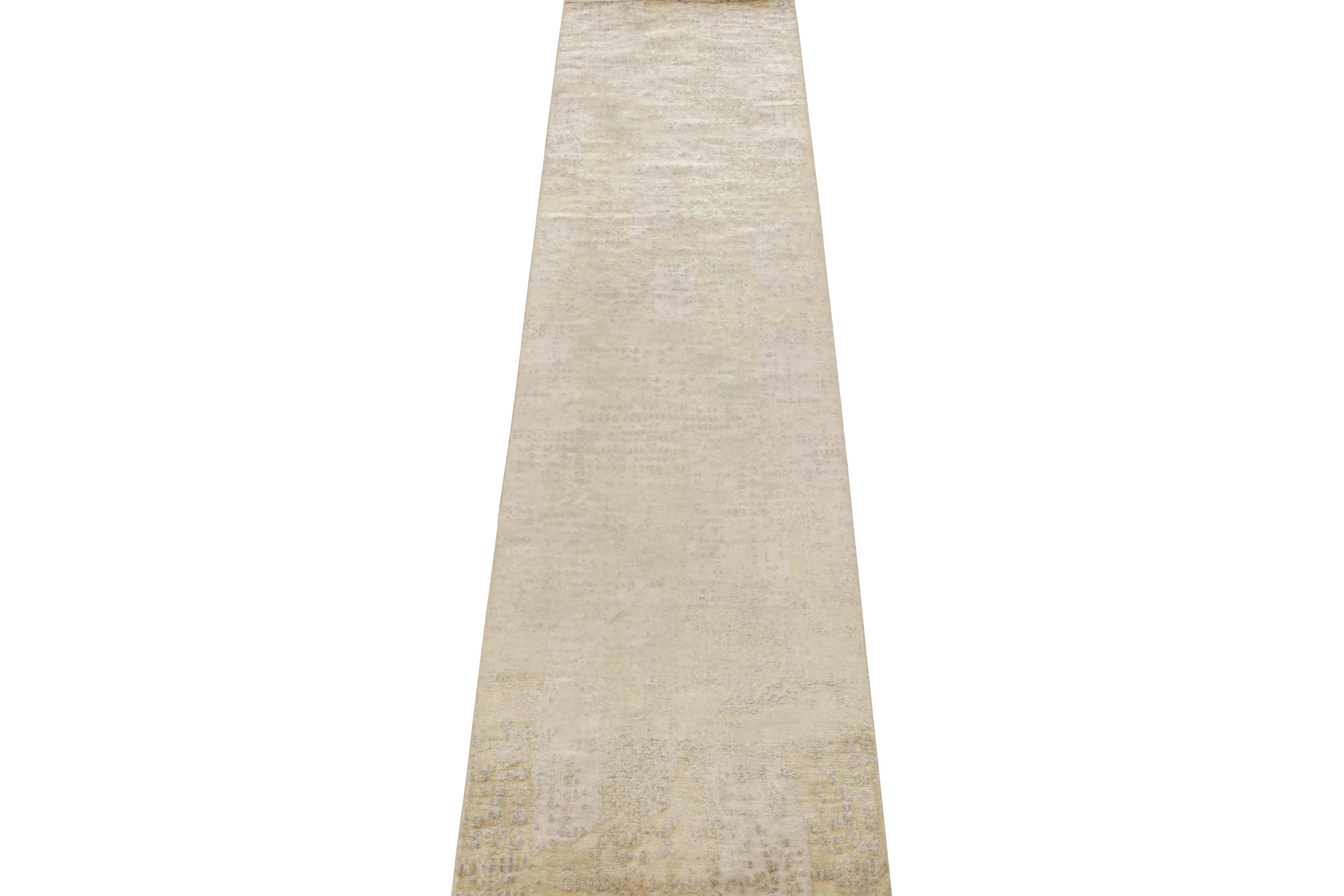 This 2x10 abstract runner is an exciting new addition to Rug & Kilim’s Modern rug collection. 

Hand knotted in luxe all-natural silk, its design enjoys an all over pattern in brilliant silver-gray with ivory tones. Keen eyes will further note a