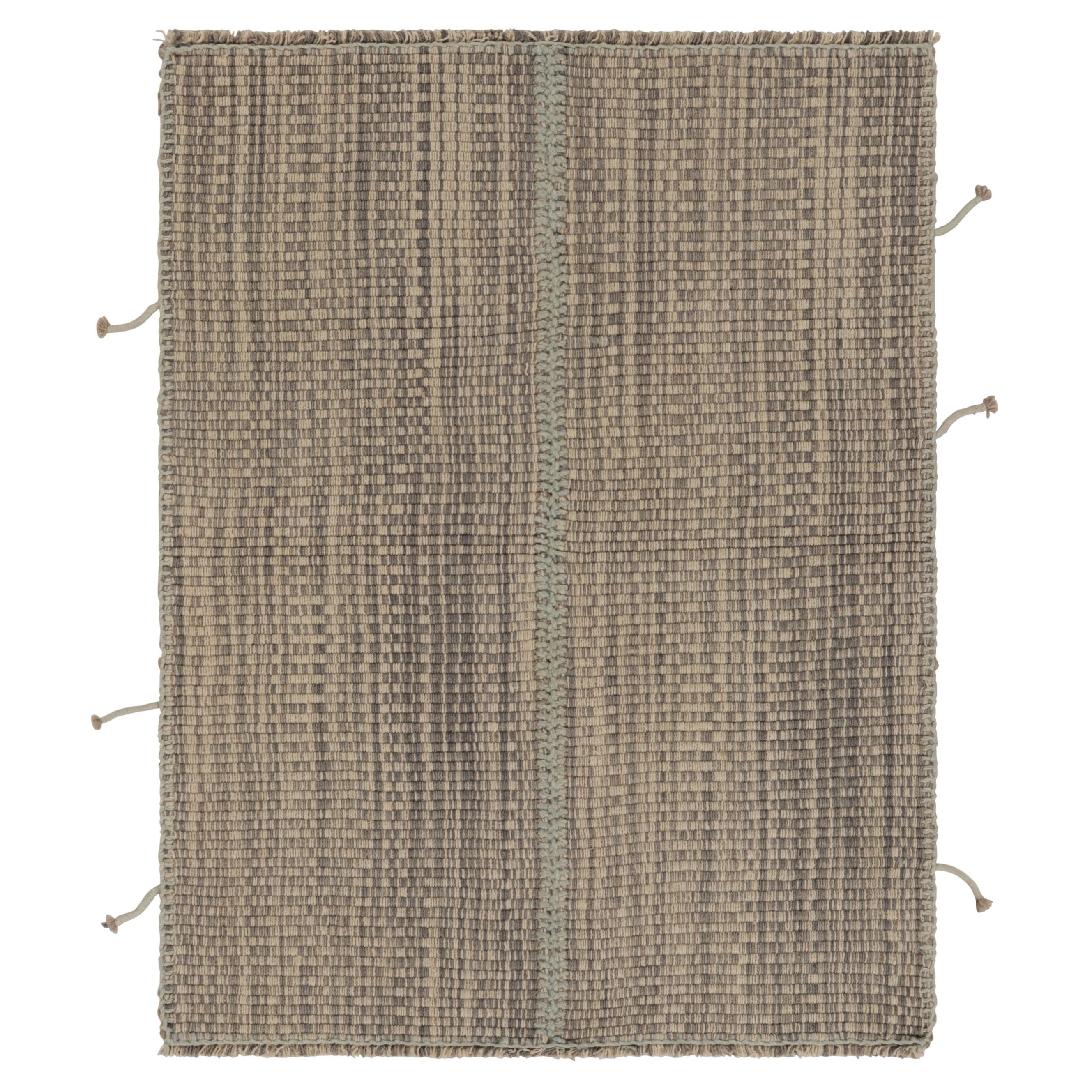 Rug
Kilim è un kilim d
accento, a strisce beige e grigie con accenti blu.