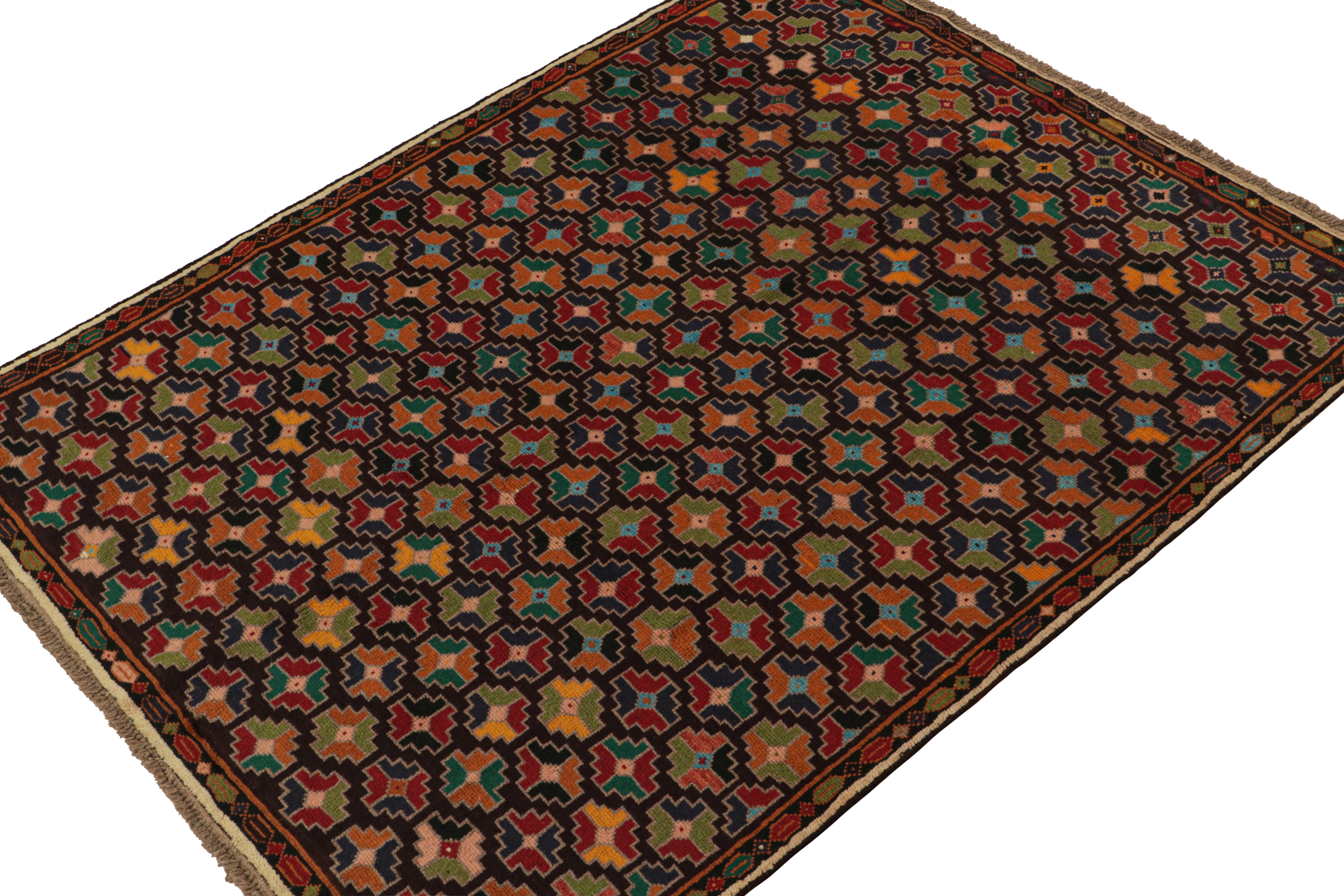 Hand knotted in wool, this 6x8 Baluch rug represents a new line of tribal carpets in the Modern Classics Collection by Rug & Kilim. Each piece  represents the work of women weavers in Afghanistan, preserving the rich tradition of their centuries-old