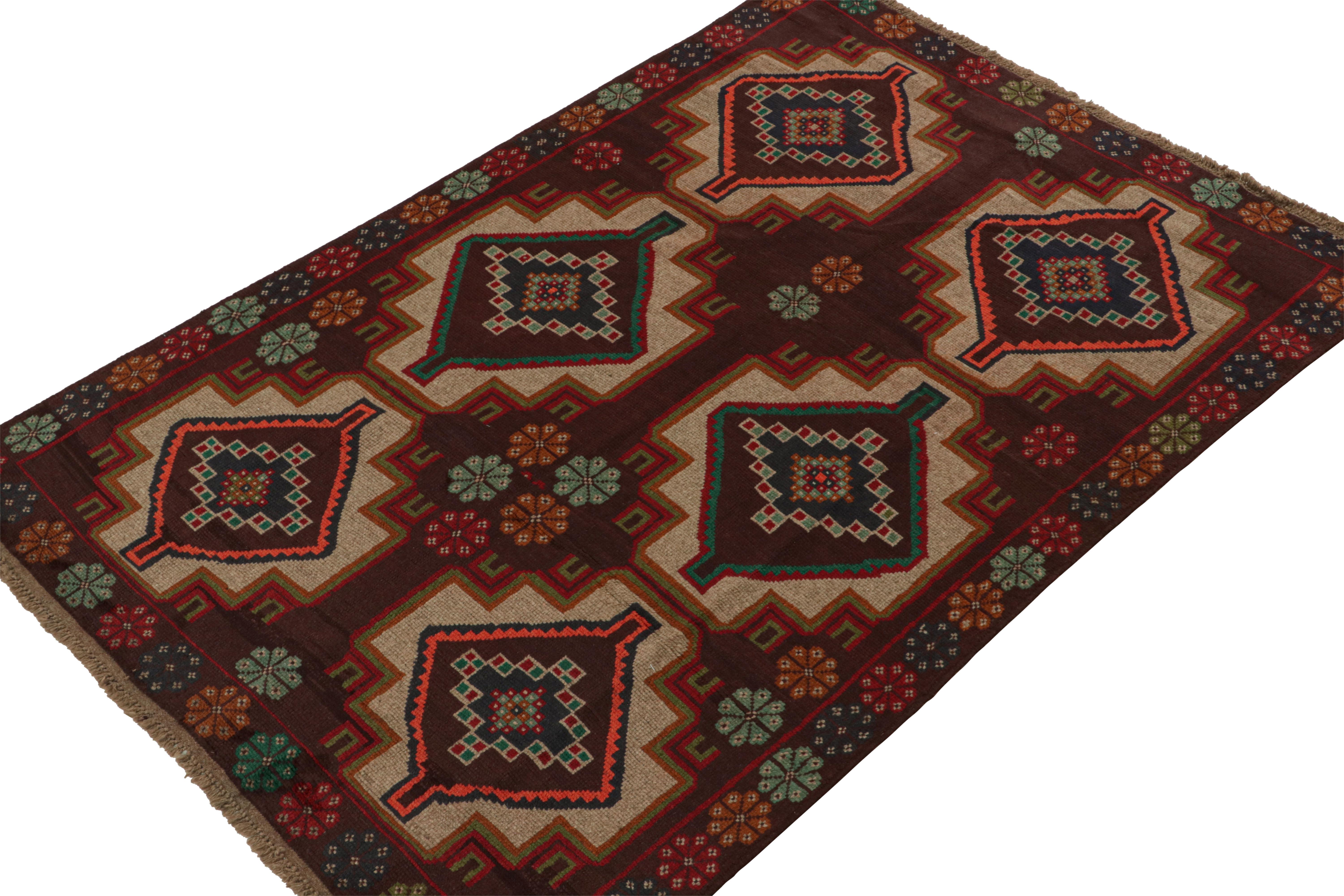 Hand knotted in wool, this 6x8 Baluch rug represents a new line of tribal carpets in the Modern Classics Collection by Rug & Kilim. Each piece  represents the work of women weavers in Afghanistan, preserving the rich tradition of their centuries-old