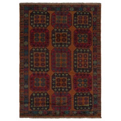 Rug & Kilim’s Afghan Baluch Tribal Rug in Rust with Red and Teal Medallions