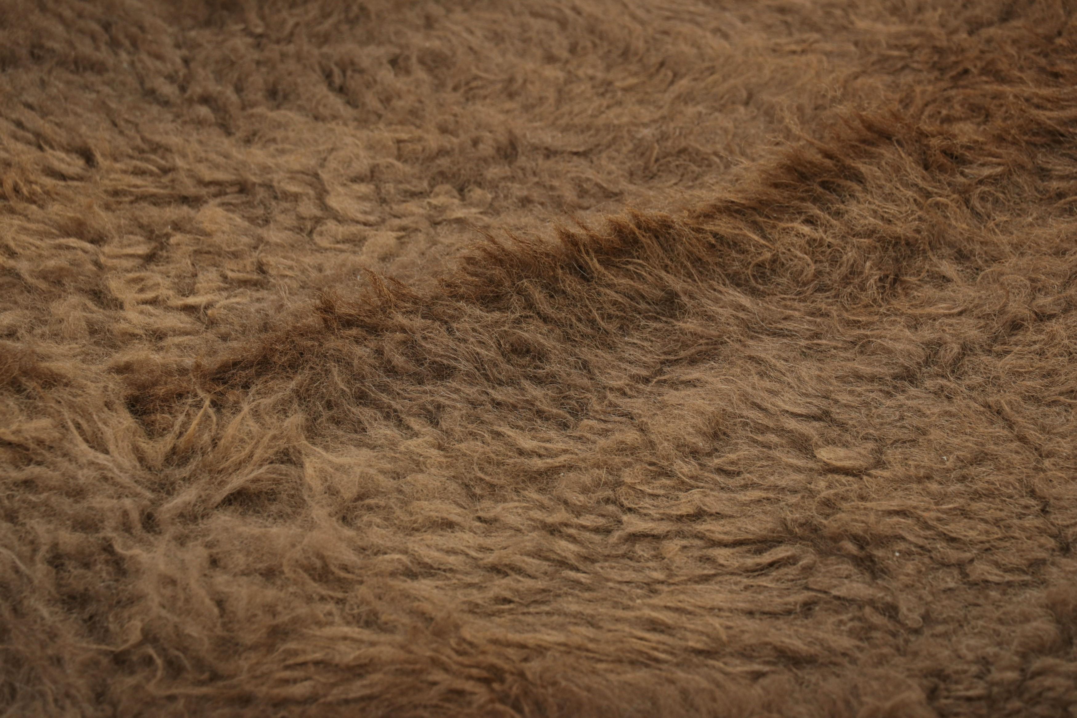 This handmade 7x8 contemporary bison hide rug from Rug & Kilim represents an exciting new collection of rare large-size pieces in the style—each a comfortable and stylish addition to a wide range of spaces for their unique shape inherent to the