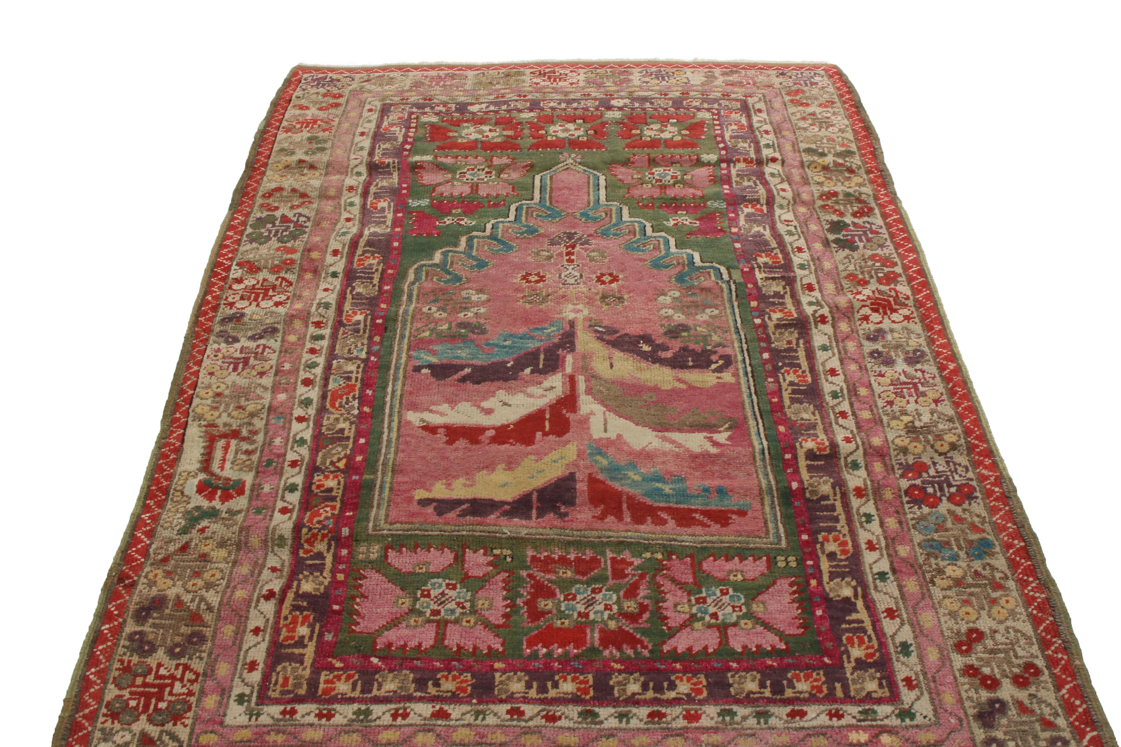 Originating from Turkey in 1880, this antique transitional Anatolian wool rug features an uncommon floral field design and a wide variety of colorways. hand knotted in high-quality wool, the red, golden-beige, blue, white, and purple fanning leaves