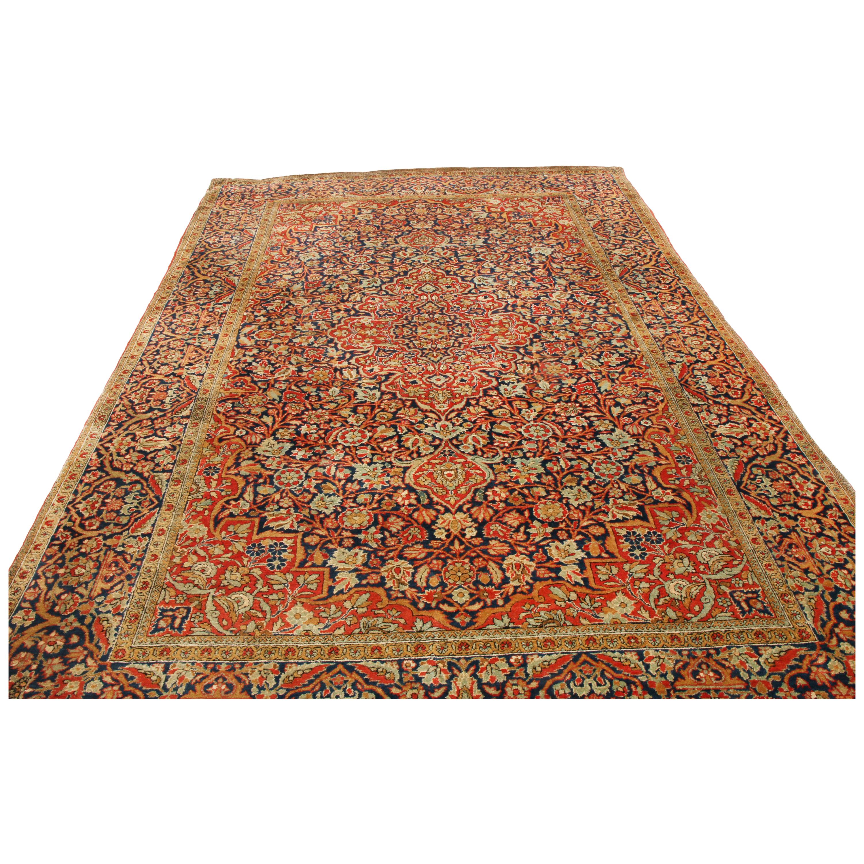 Originating from Persia between 1900-1910, this antique traditional Persian rug is hand knotted in naturally iridescent silk to complement an extremely fine all-over field design. The spacious central pattern includes lancet leaves and curvilinear