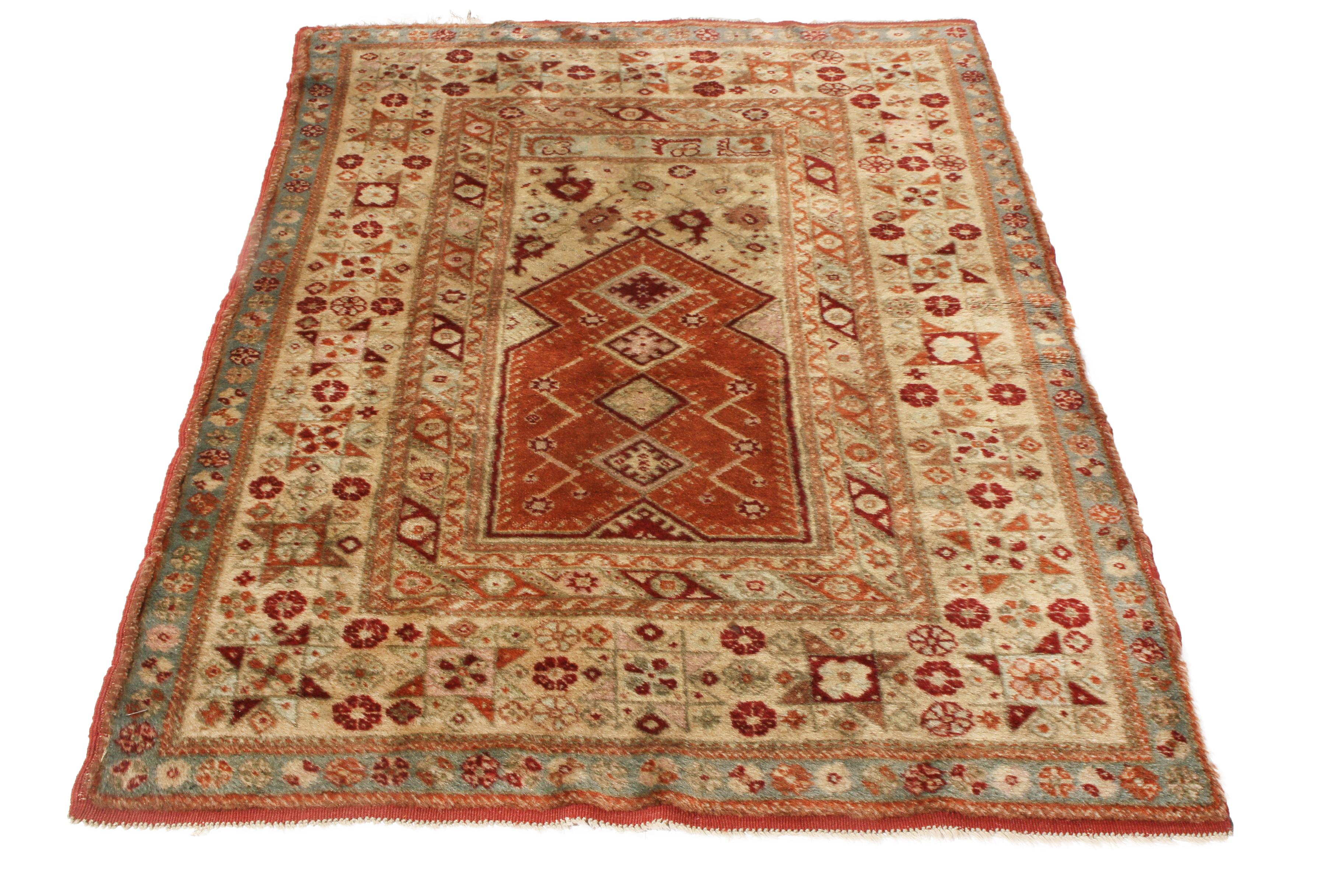 Originating from Europe in 1910, this antique traditional Oushak rug employs a seldom-seen abundance of various oriental symbols. Hand knotted in high-quality wool, the geometric field and border designs alike feature variations of the eight-pointed