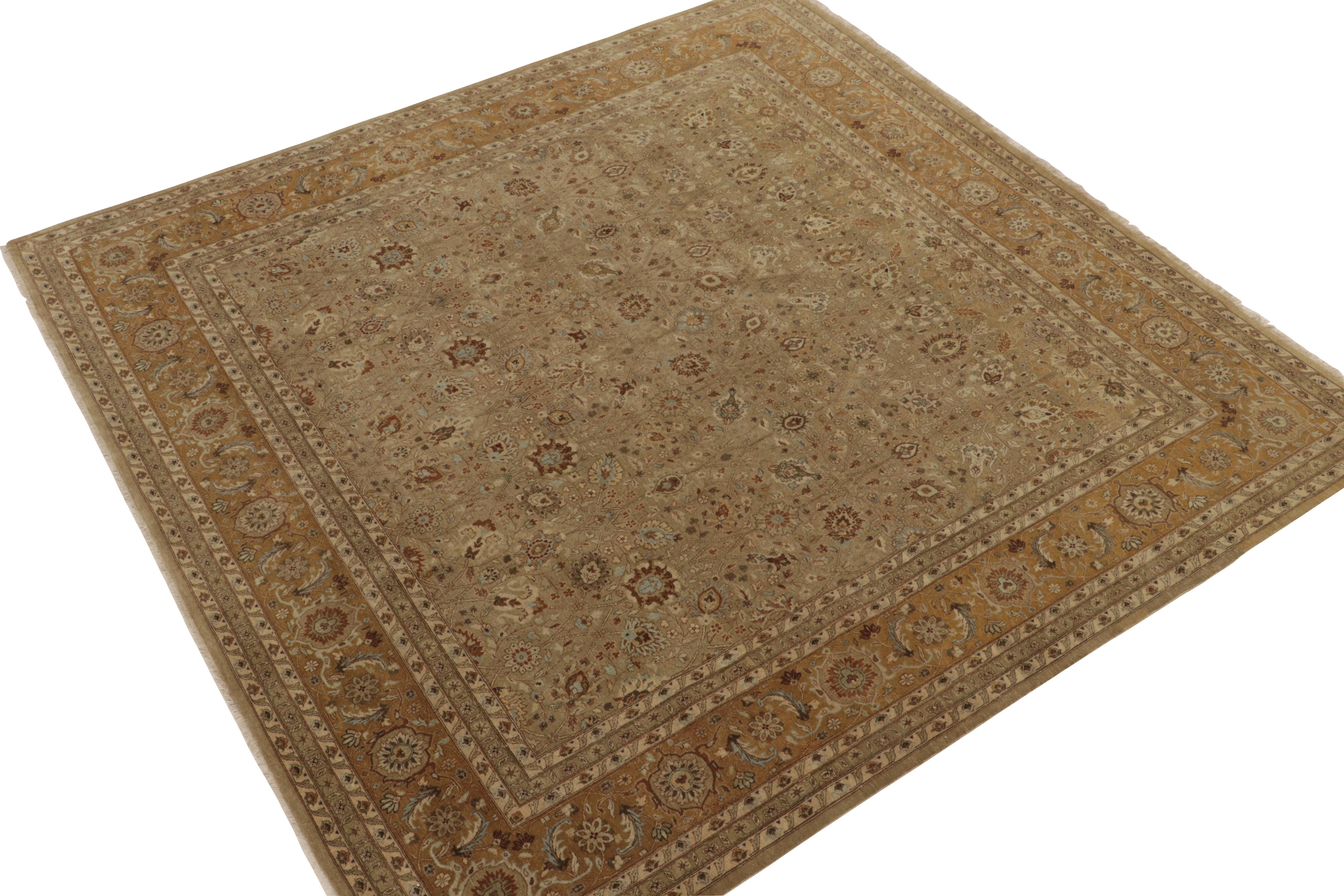 Hand-knotted in wool, this 9x9 square rug from our Modern Classics collection is a contemporary take on antique Persian rugs. 

The design enjoys an all over floral pattern in variegated tones of beige & brown & rich gold with subtle blue detailing.