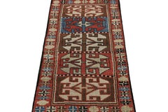 Rug & Kilims antiker Teppich im Stammesstil mit roten, blauen und braunen Mustern