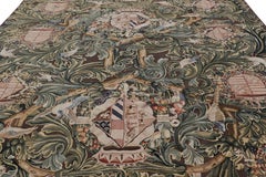 Rug & Kilim’s Armorial Tudor Style Rug in Black, with Beige, Blue and Gold Tones