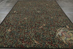 Rug & Kilim’s Armorial Tudor Style Rug in Green and Red Floral Patterns