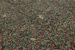 Rug & Kilim’s Armorial Tudor Style Rug in Green and Red Floral Patterns
