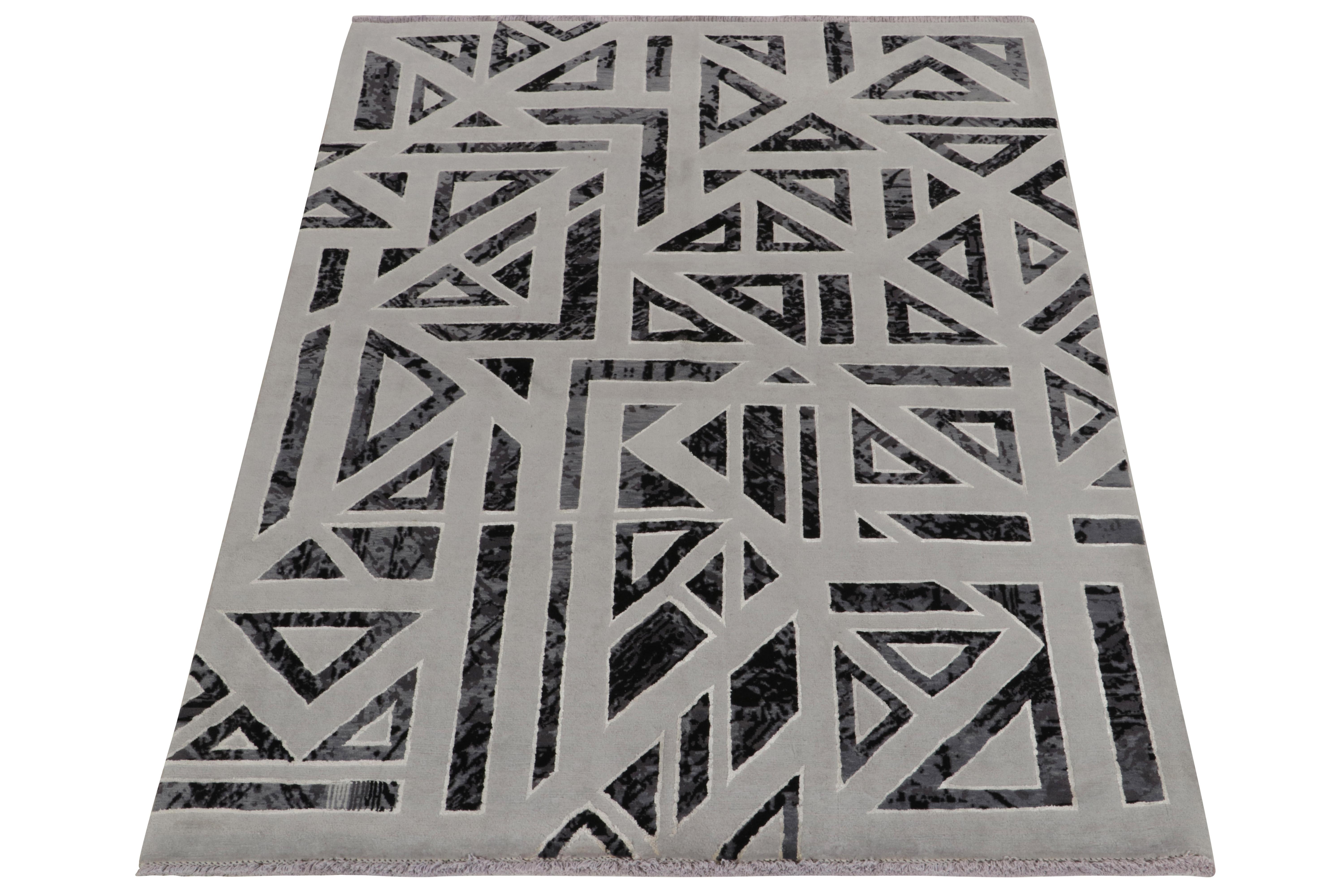 From one of our principal’s finest new partner ateliers among the very best in modern craft, a bold graphic take on Art Deco rugs with an industrial mood. Featuring geometric patterns in black & gray, the piece witnesses a subtle shift of the hues