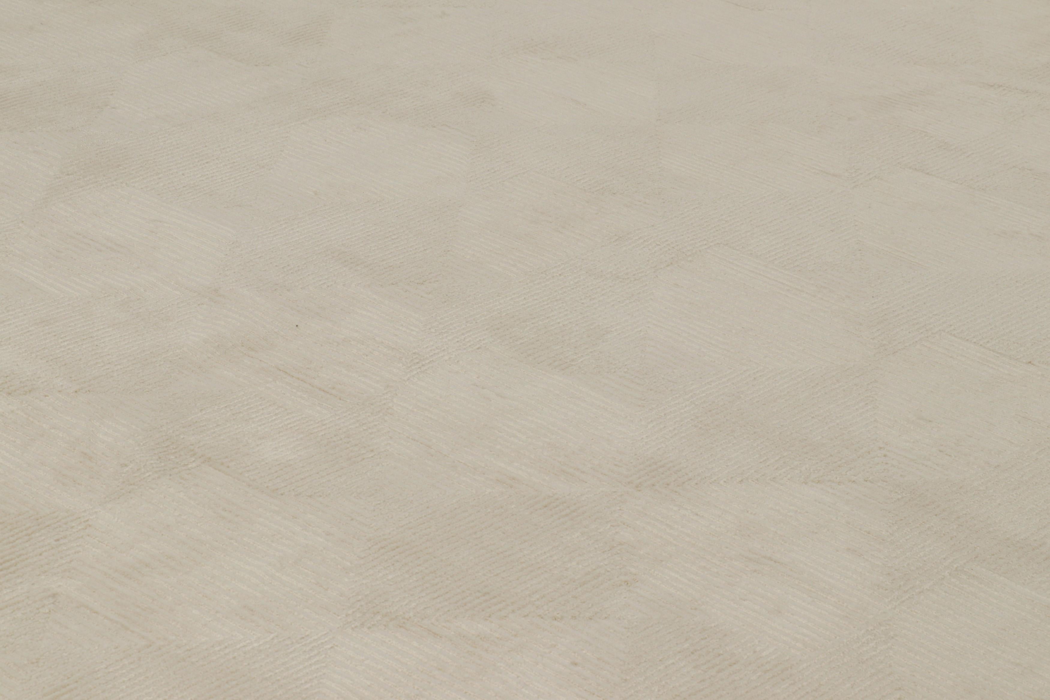 Hand-knotted in wool and silk, this 9x12 modern art deco rug is in one of our most luxurious modern constructions adapting 1920s cubist sensibilities 

On the Design: 

Connoisseurs may admire this piece with rippling geometric patterns in creamy