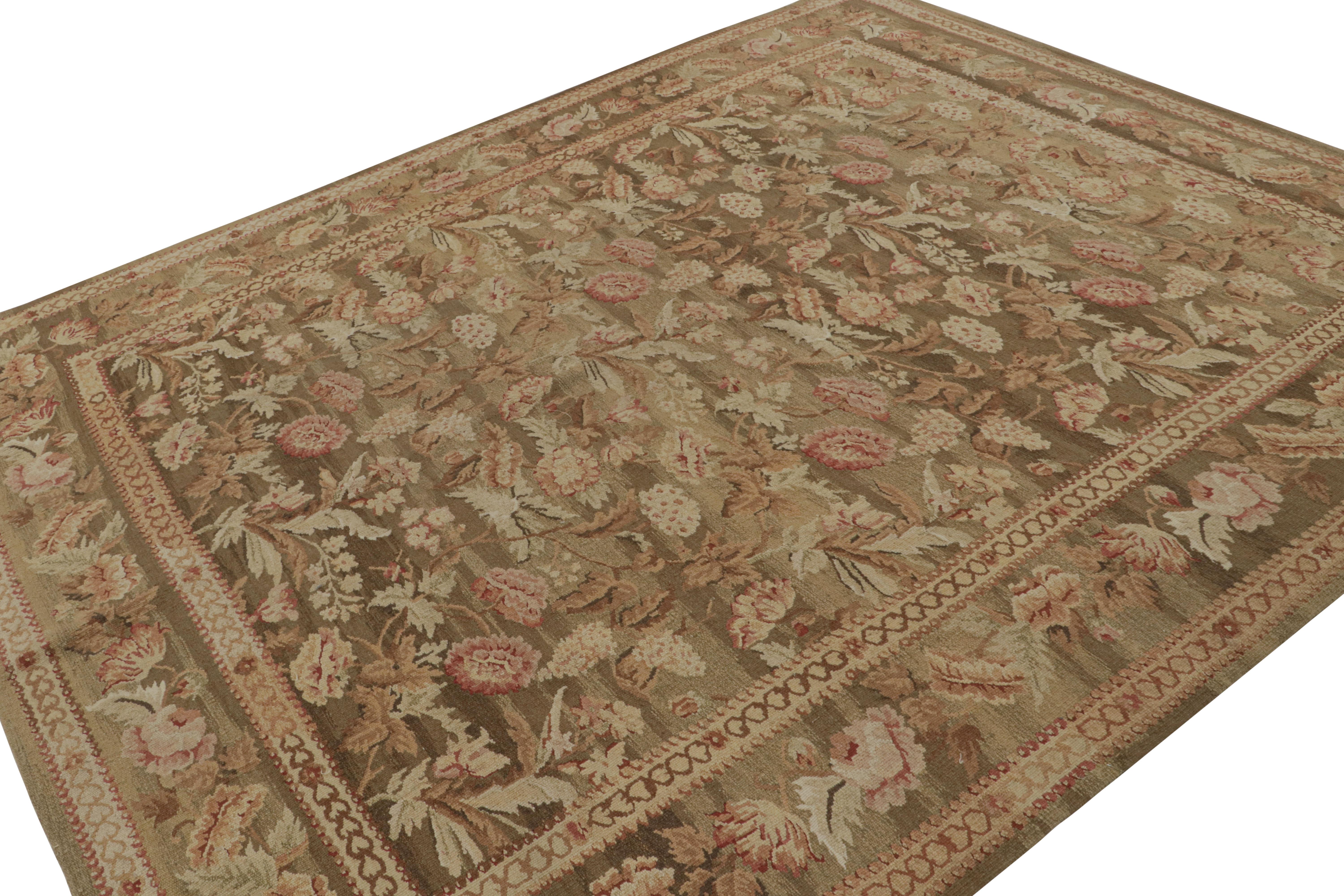 Handwoven in wool, this 8x10 Aubusson flatweave rug in rich beige/brown features colorful floral botanical patterns in present pink and cream tones. 

On the Design: 

This design has been Inspired by 18th century Aubusson rugs and tapestries in