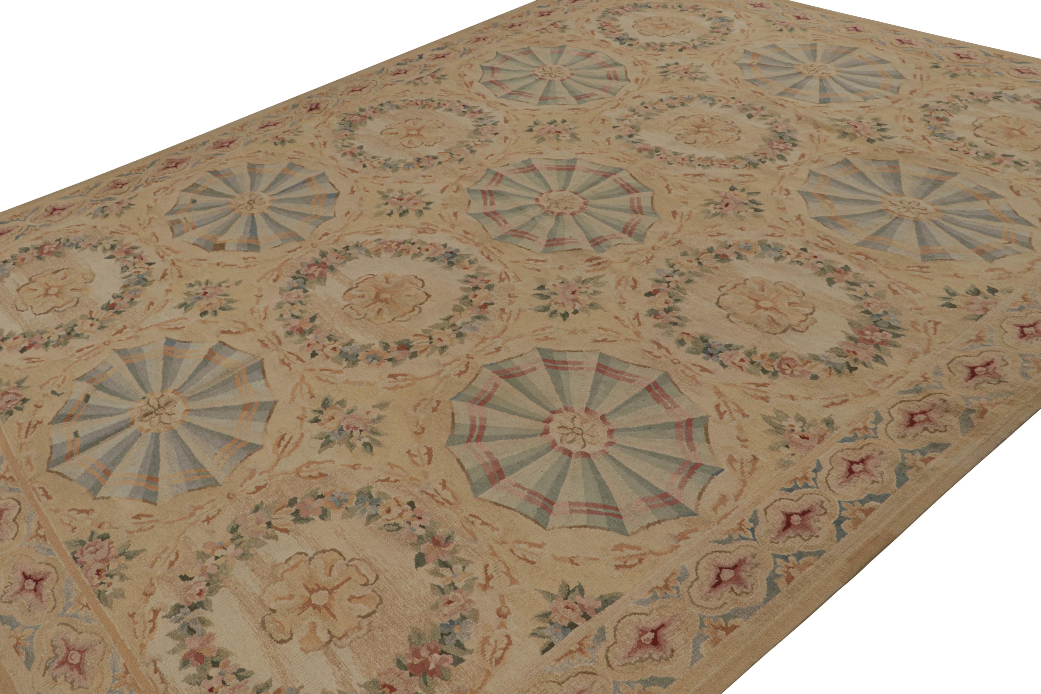 Handwoven in wool, this 9x12 Aubusson flatweave rug in brown features colorful floral patterns and medallions, some in the cartouche style and others in wreaths, in present light blue, pink and green tones. 

On the Design: 

This design has been