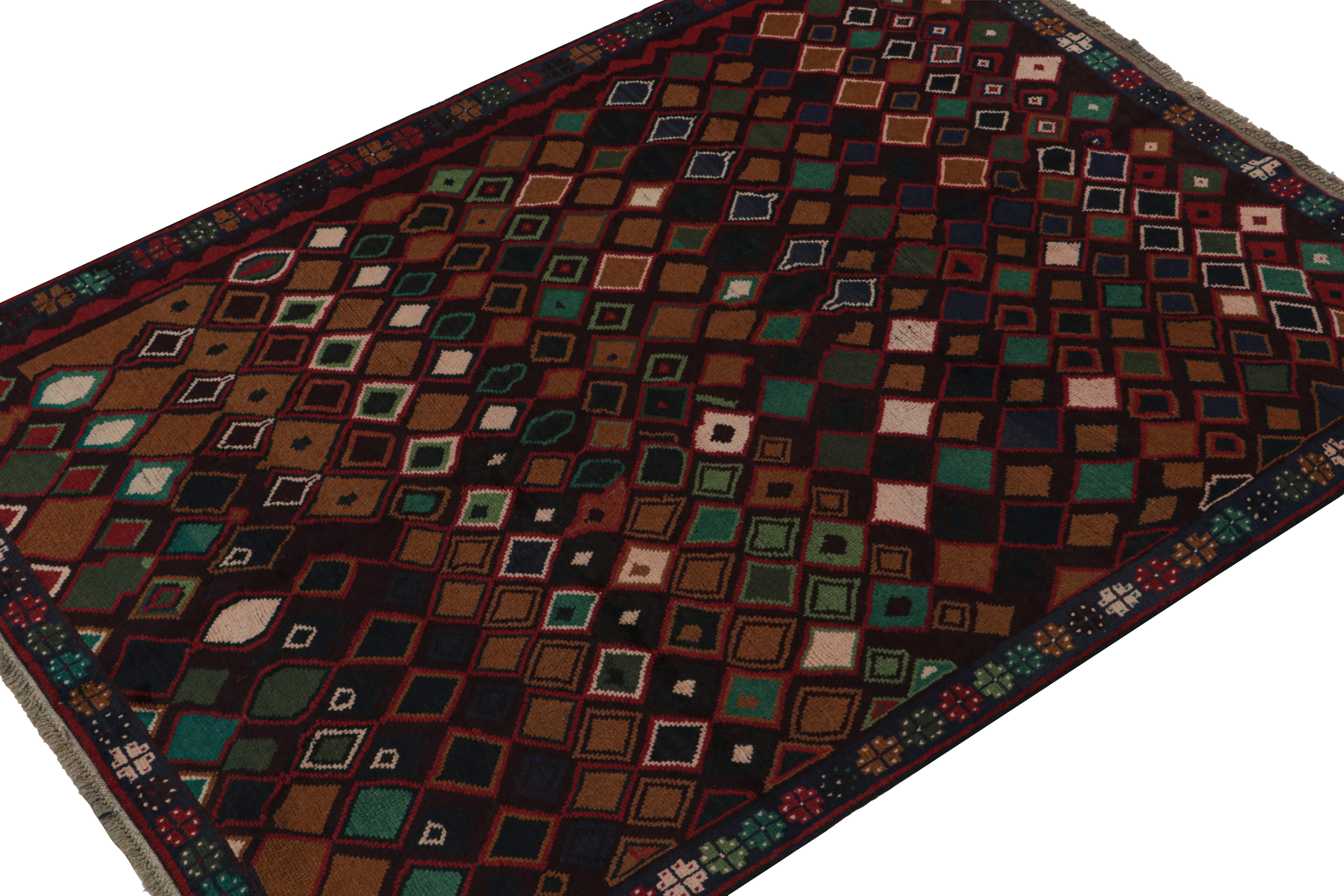 Hand knotted in wool, this 6x8 Baluch rug represents a new line of tribal carpets in the Modern Classics Collection by Rug & Kilim. Each piece  represents the work of women weavers in Afghanistan, preserving the rich tradition of their centuries-old