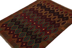 Rug & Kilim’s Baluch Tribal Rug in Rust Tones with Colorful Hexagon Patterns