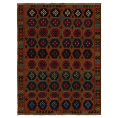 Rug & Kilim’s Baluch Tribal Rug in Rust Tones with Colorful Hexagon Patterns