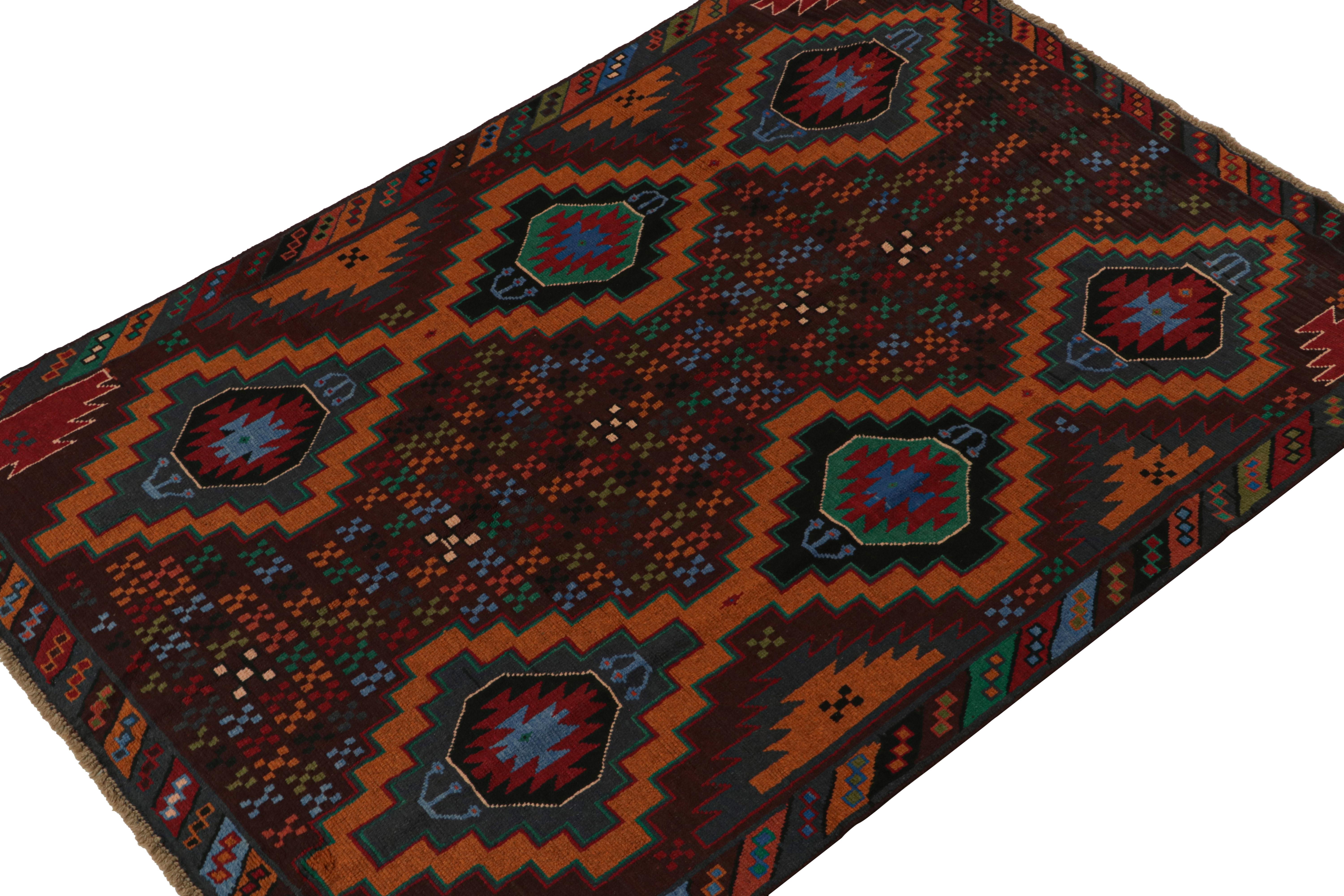 Hand knotted in wool, this 6x8 Baluch rug represents a new line of tribal carpets in the Modern Classics Collection by Rug & Kilim. Each piece  represents the work of women weavers in Afghanistan, preserving the rich tradition of their centuries-old