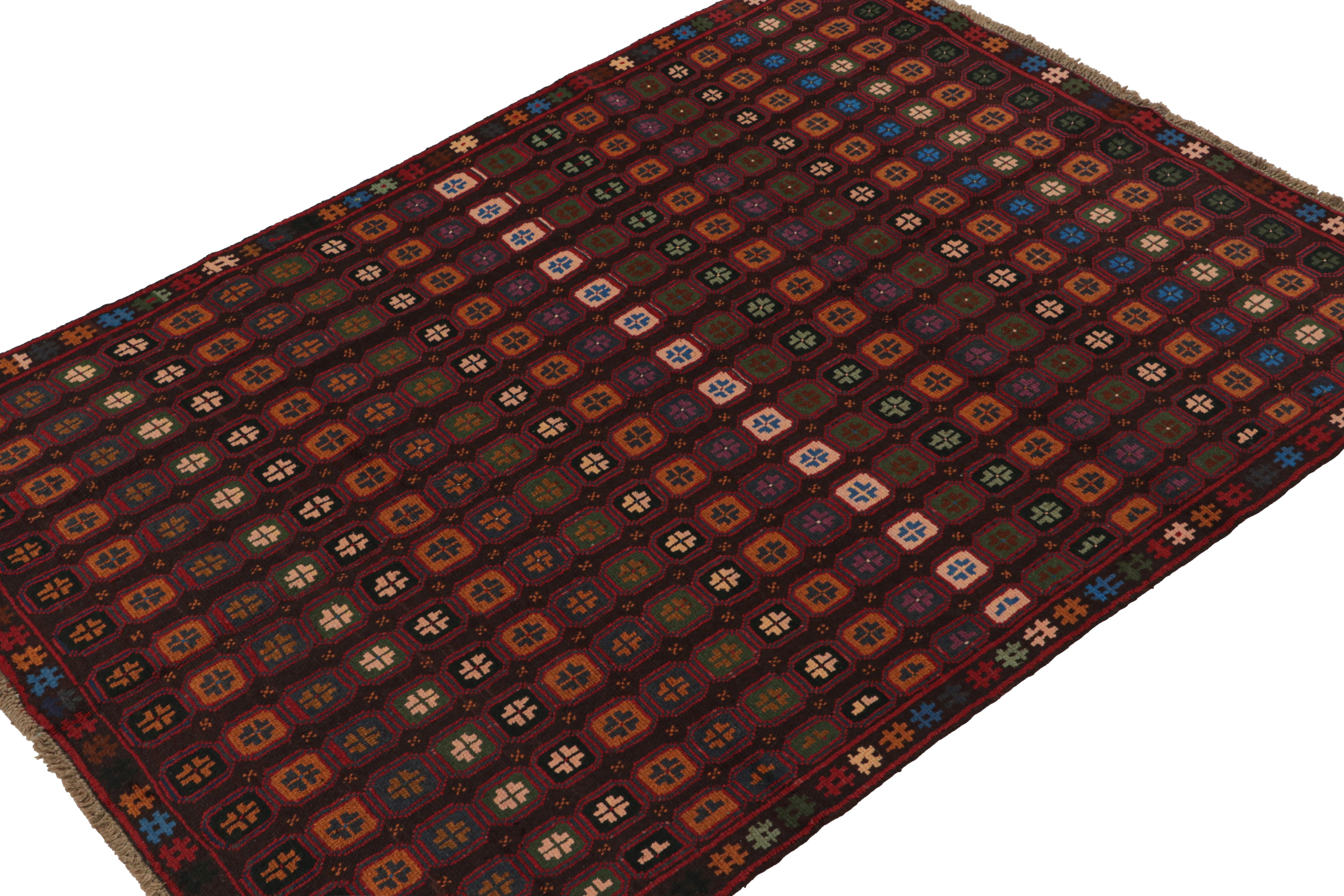 Hand knotted in wool, this 6x8 Baluch rug represents a new line of tribal carpets in the Modern Classics Collection by Rug & Kilim. Each piece  represents the work of women weavers in Afghanistan, preserving the rich tradition of their centuries-old
