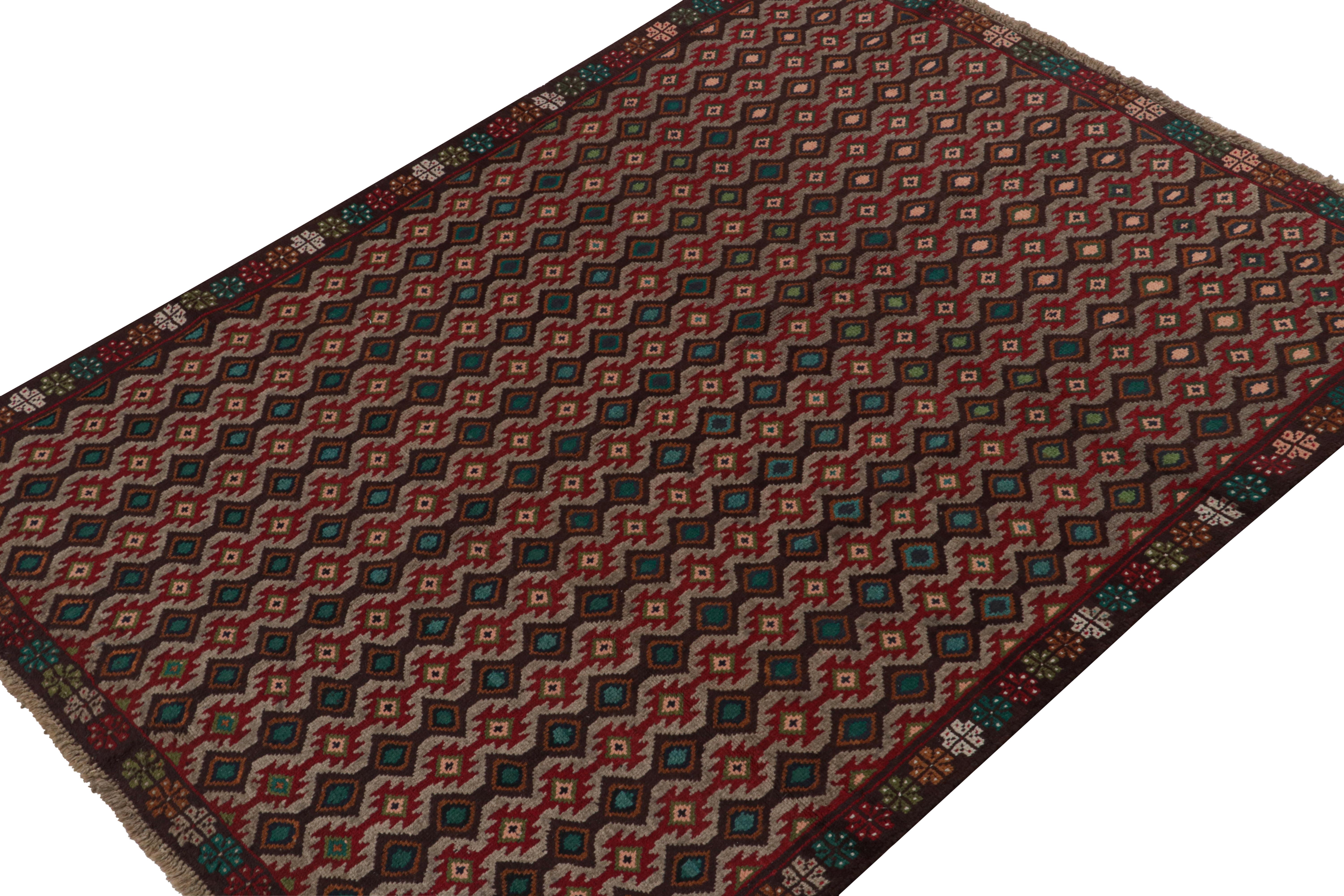 Hand knotted in wool, this 6x8 Baluch rug represents a new line of tribal carpets in the Modern Classics Collection by Rug & Kilim. Each piece  represents the work of women weavers in Afghanistan, preserving the rich tradition of their centuries-old