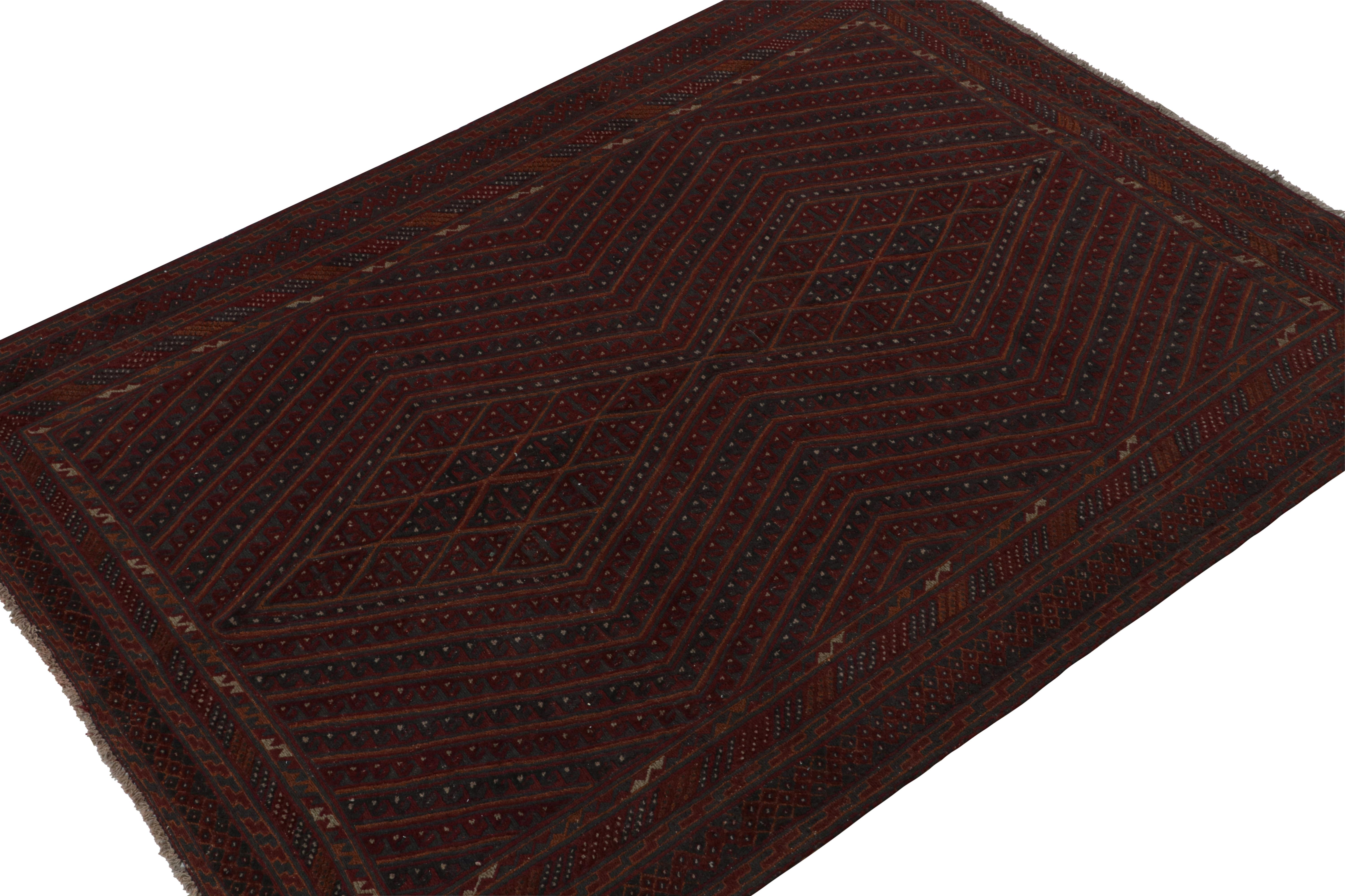 Hand knotted in wool, this 7x9 Baluch rug represents a new line of tribal carpets in the Modern Classics Collection by Rug & Kilim. Each piece  represents the work of women weavers in Afghanistan, preserving the rich tradition of their centuries-old
