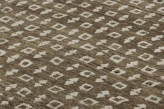 Rug & Kilim’s Block Print Rug in Brown with Cream Geometric Patterns