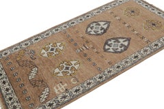 Rug & Kilim’s Brown Tribal Style Runner Rug with Primitivist Geometric Patterns