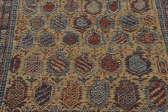 Rug & Kilim’s Caucasian Inspired Rug with Gold and Rust Paisley Motifs
