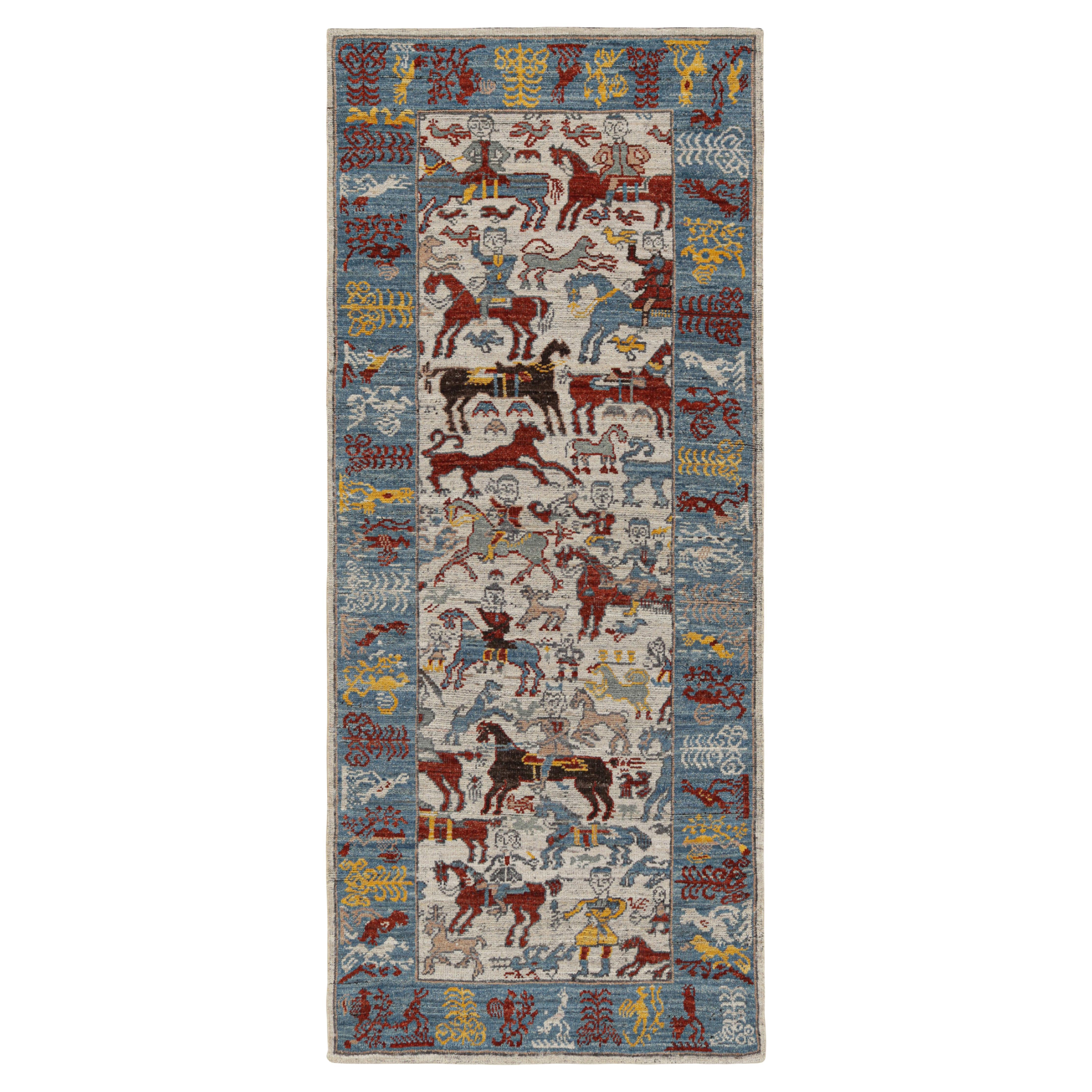 Rug & Kilim è un tappeto da corsa in stile caucasico con immagini colorate di cavalieri.