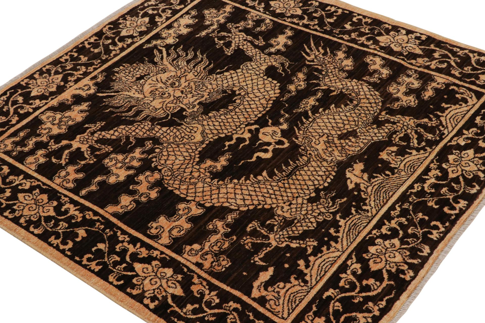 Hand-knotted in wool, this 4x4 pictorial rug is inspired by antique Chinese dragon rugs—a new addition to Rug & Kilim’s Modern Classics Collection. 

On the Design: 

The piece carries a dragon pictorial pattern in gold on a brown-black background. 