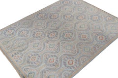 Rug & Kilim’s Classic Ikats style rug with Blue, Gold and Rust Red Patterns