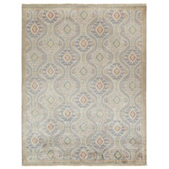 Alfombra de estilo ikats clásico de Rug & Kilim con motivos azul, dorado y rojo óxido