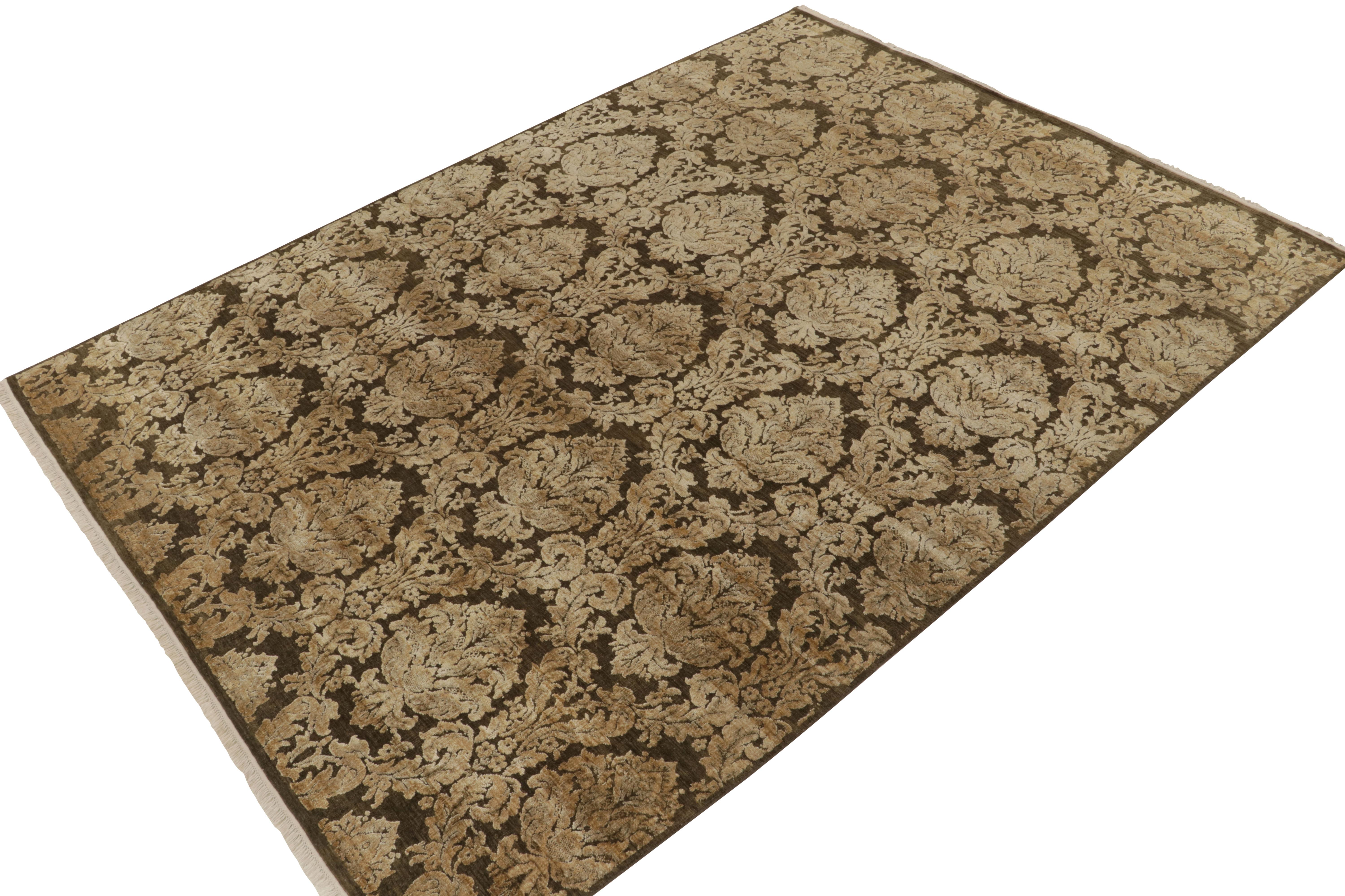 Hand-knotted in a fine blend of wool & silk, a 9x12 contemporary rug from our Modern Classics collection. 

On the Design: This piece enjoys classic European inspirations, particularly by antique Italian floral crests gold and beige tones on rich