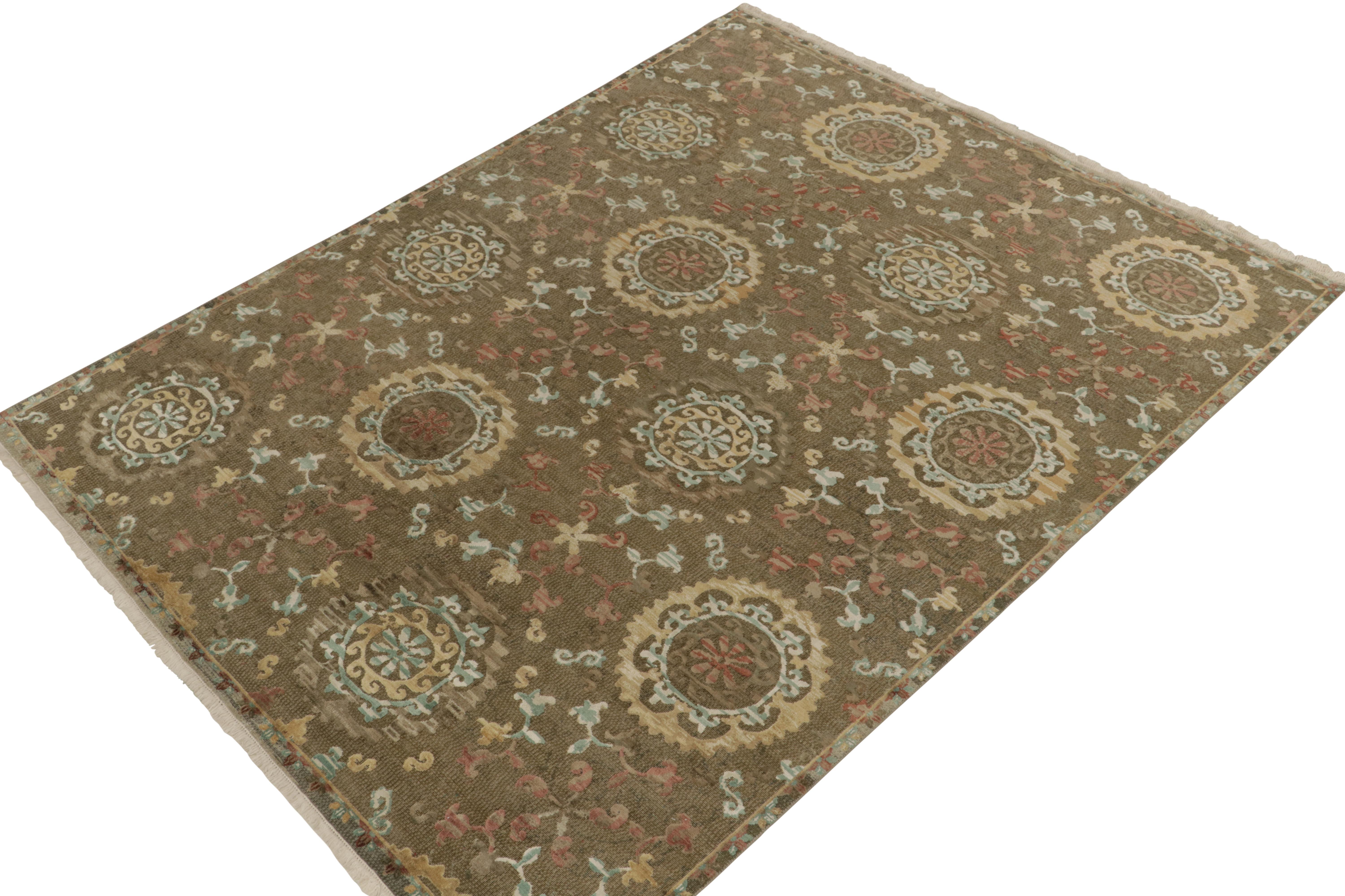 Handknotted in luxurious silk, this 8x10 contemporary rug from our Modern Classics collection is particularly inspired by antique Spanish rugs. The gracious scale revels in wheel-style floral medallions in beige-brown, gold & blue colorways with a