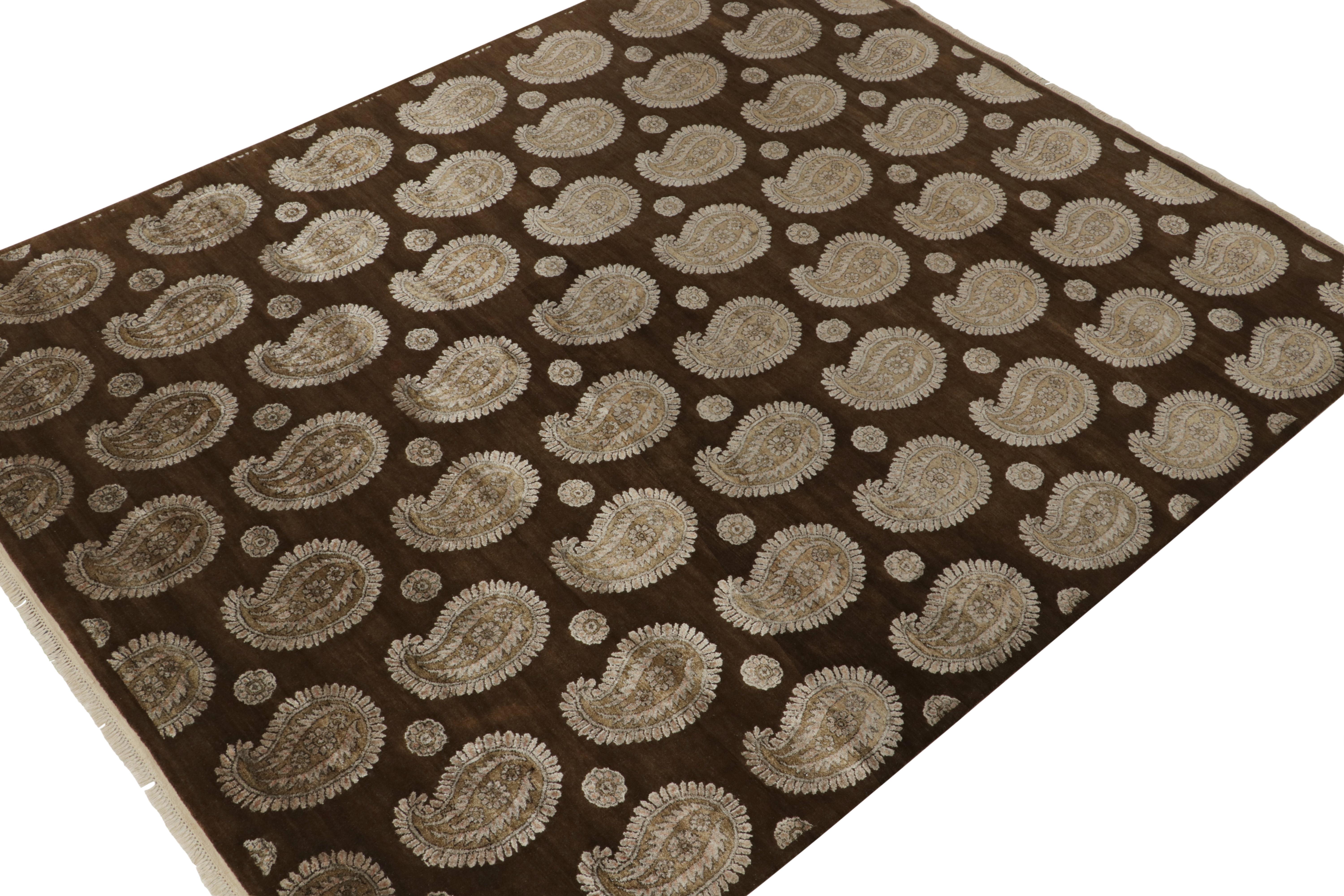 An 8x10 rug inspired from traditional rug styles, from Rug & Kilim’s Modern Classics Collection. Hand-knotted in wool, boasting golden-beige paisley patterns on a chocolate brown background in tasteful repetition.
Further On the Design:
The play