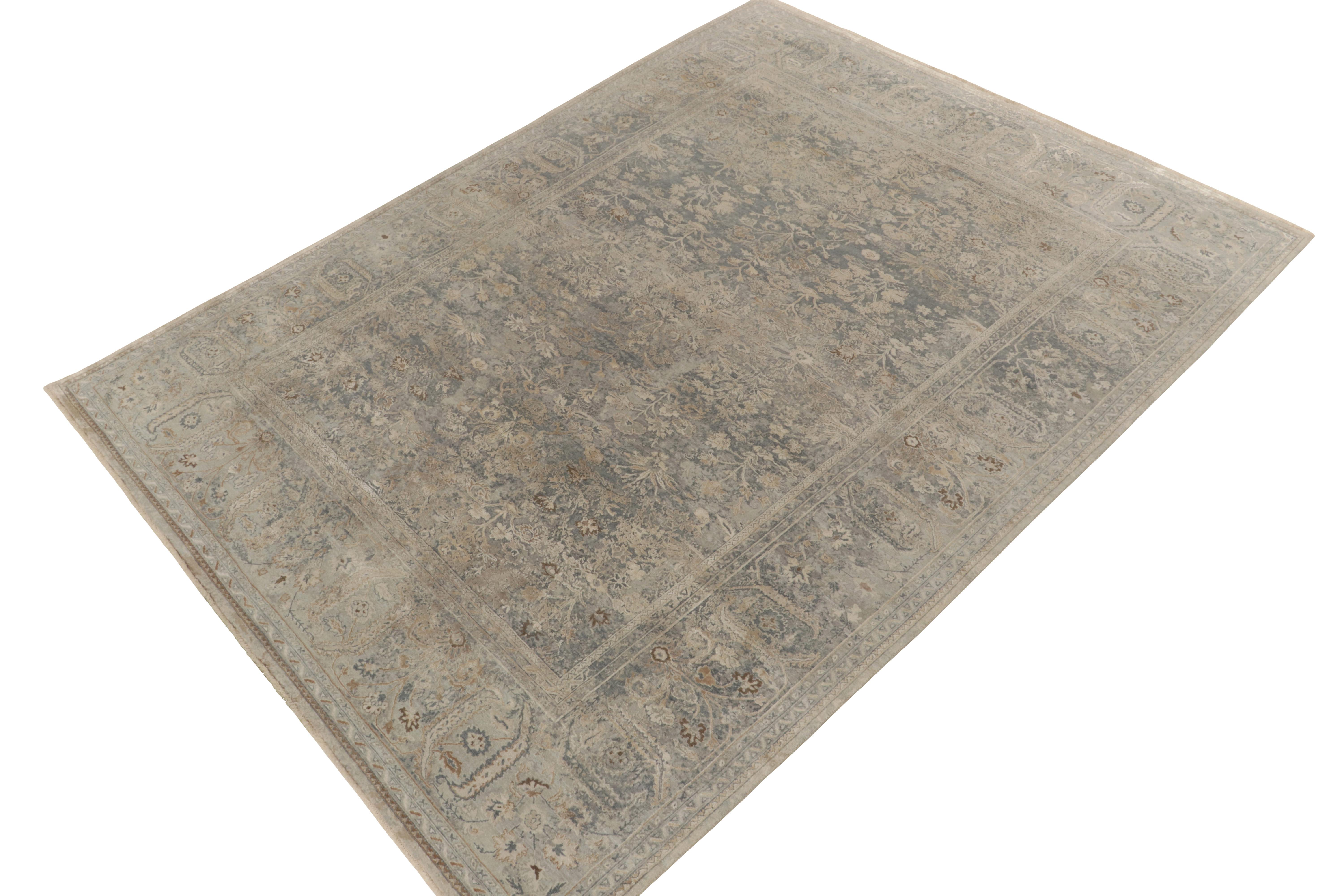 Realizing a sophisticated take on Classic style, Rug & Kilim presents a 9x12 modern rug of unparalleled beauty. Elegantly playing positive negative in silver gray, blue & beige, the floral imagery enjoys a tonal balance perfectly complementing the