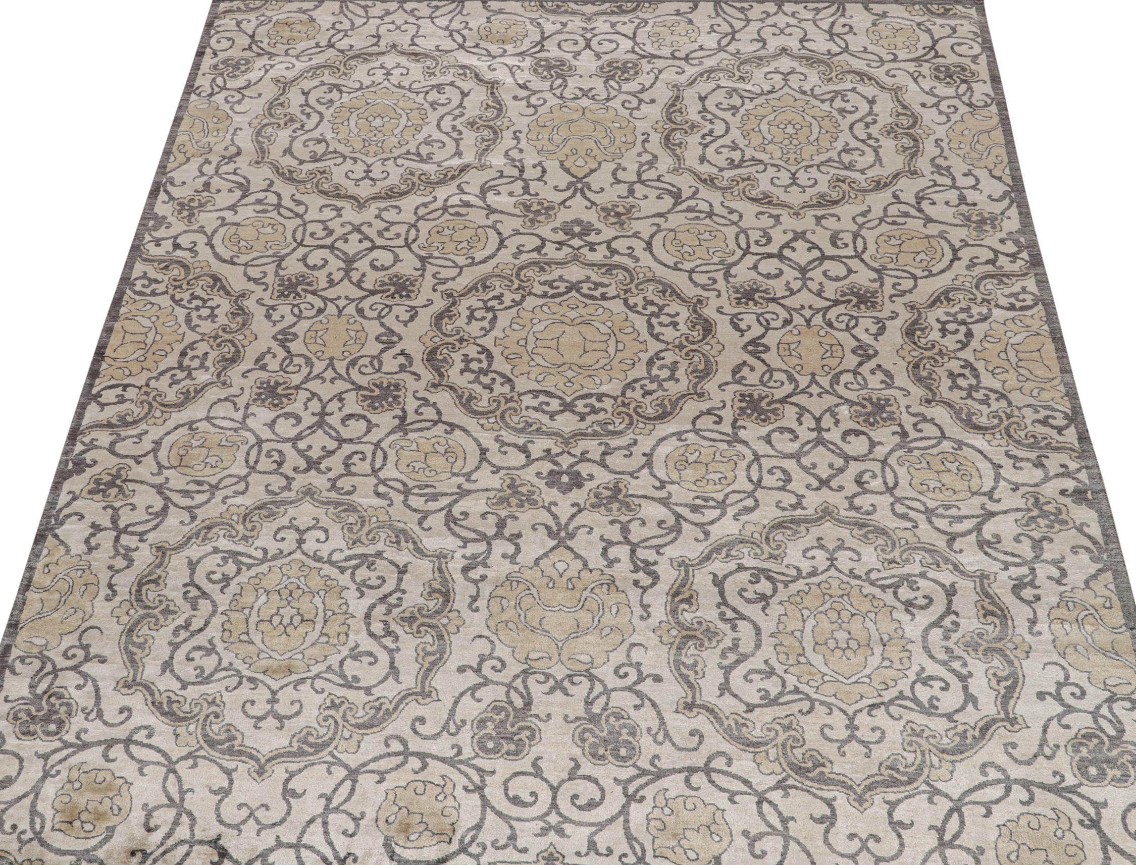 An 8x10 rug inspired from traditional rug styles, from Rug & Kilim’s Modern Classics Collection. Hand knotted in wool, playing a confluence of gray, beige-brown and gold floral medallions with classic grace.
Further on the design:
Connoisseurs