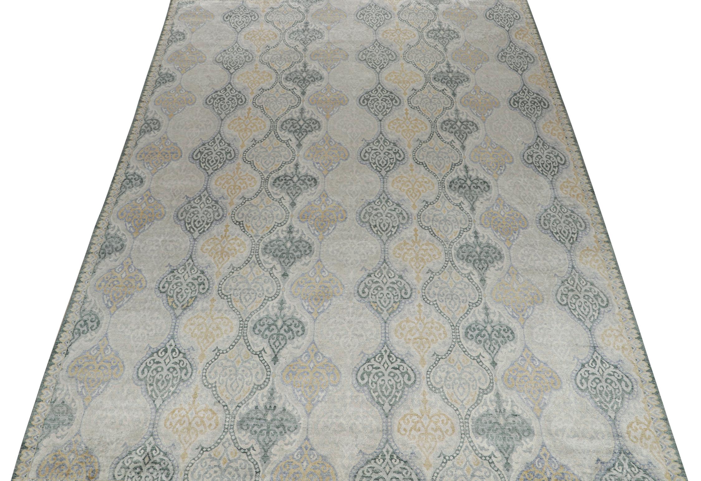 A 9x12 rug inspired from traditional rug styles, from Rug & Kilim’s Modern Classics Collection. Hand-knotted in wool, playing a confluence of gray, beige, blue and gold floral patterns with classic grace.
Further on the design:
Keen eyes will admire