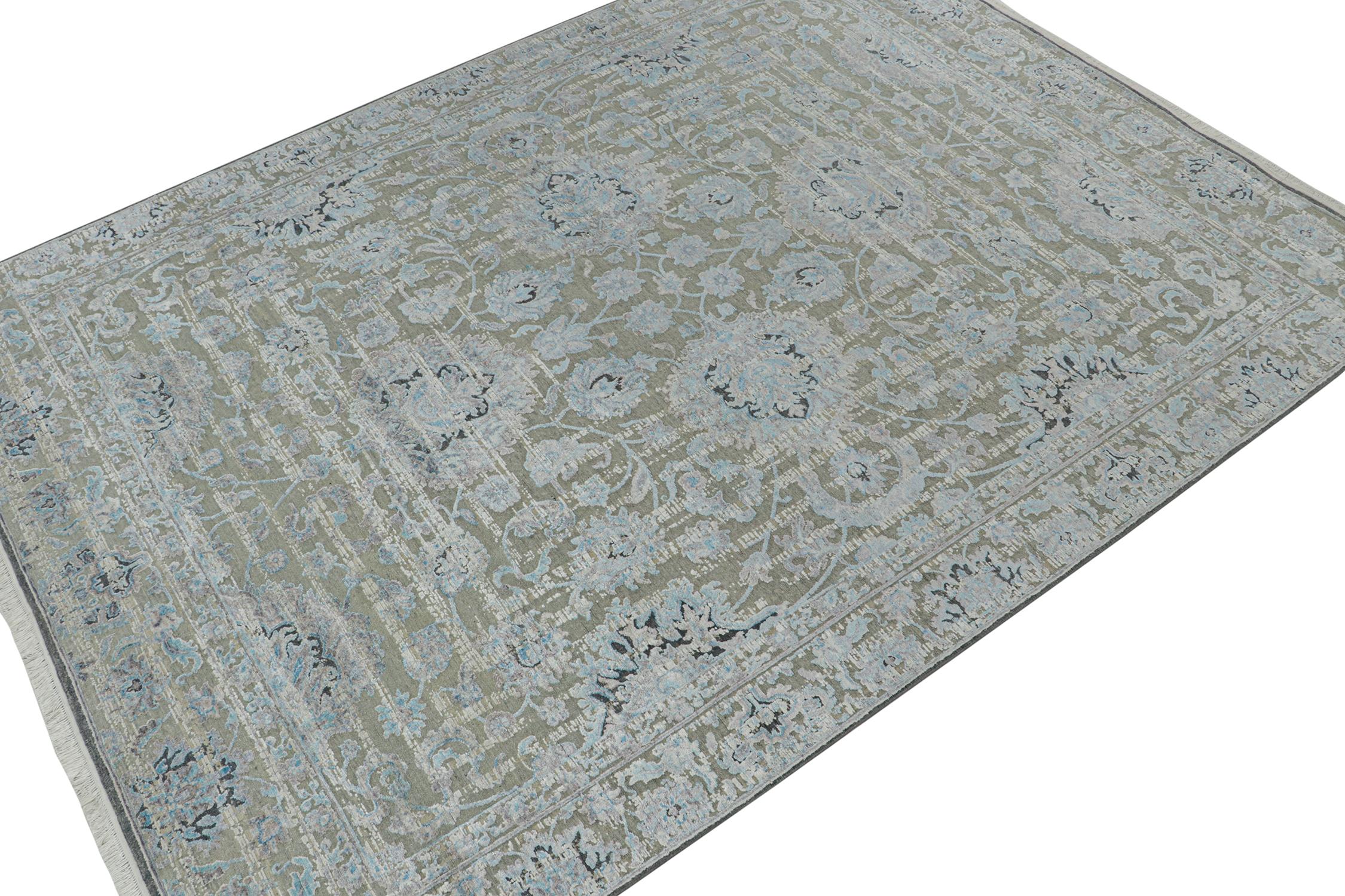A 9×12 rug inspired from traditional rug styles, from Rug & Kilim’s Modern Classics Collection. Hand knotted in silk, playing a confluence of gray and blue floral patterns with classic grace.

Further On the Design:

This piece remarks a unique