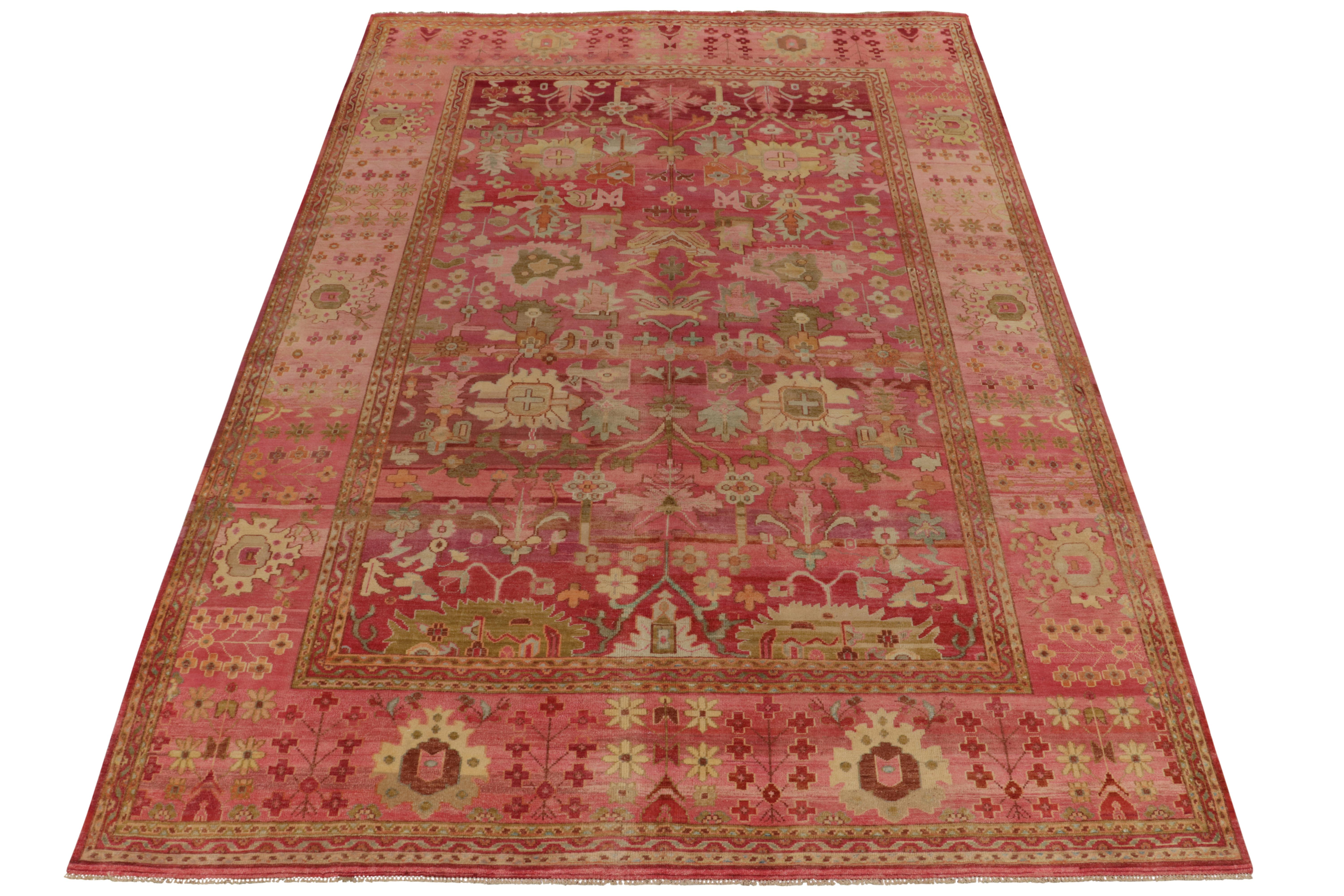 Crafted in luxurious silk, a 10x14 rug inspired by a classic style rug reimagined in a bold modern polychromatic style. Carrying an ambitious vision, the beauty of the scale manifests with a floral pattern laying in reds, pinks and beige-brown and