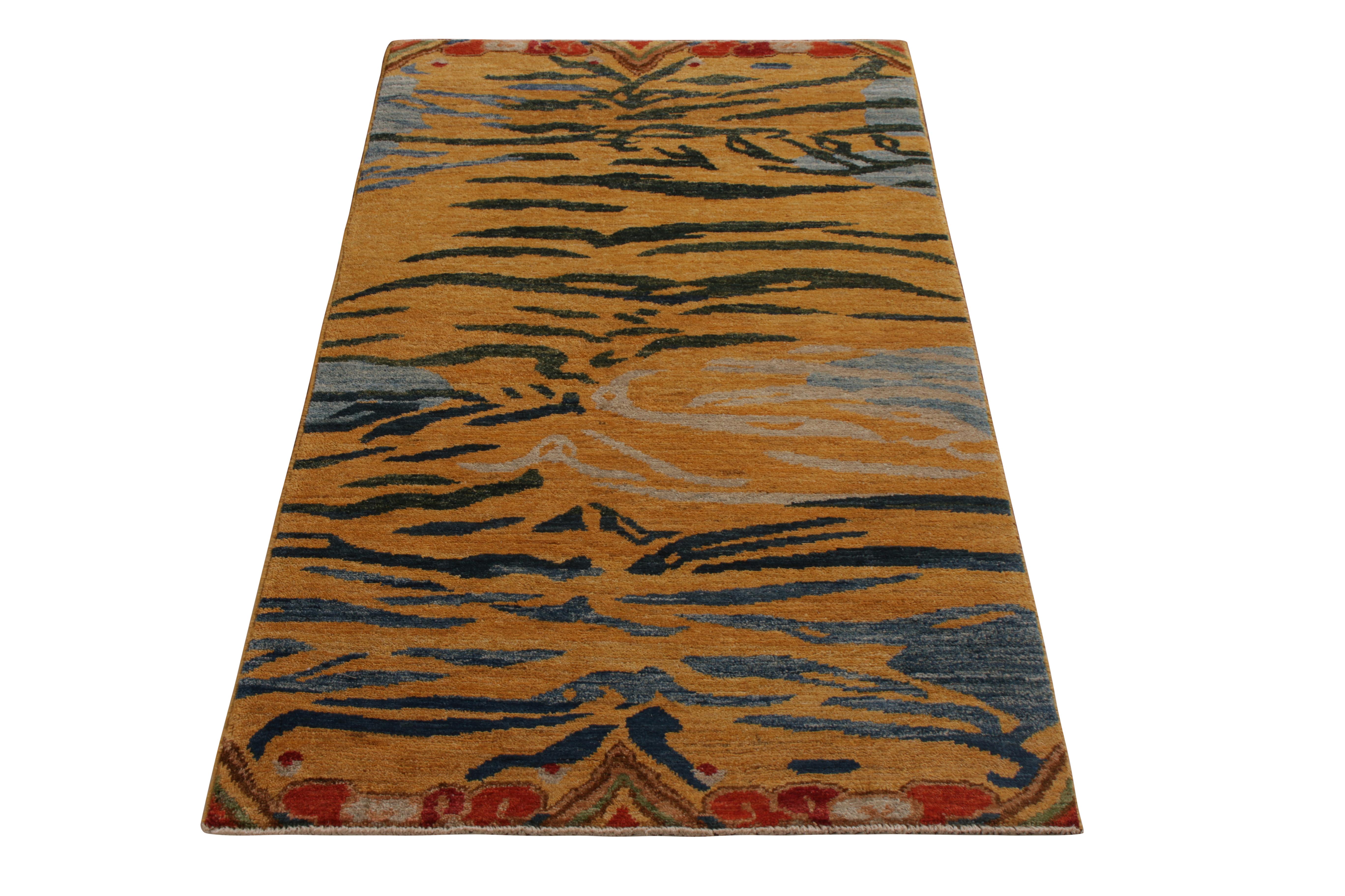 A 3x5 ode to celebrated Tiger rug styles from the titular new collection by Rug & Kilim. Hand knotted in wool, nodding to classic Tibetan abstractions of flayed Tiger stripes in abrashed orange and blue hues. Enjoying an iconic look with a sense of