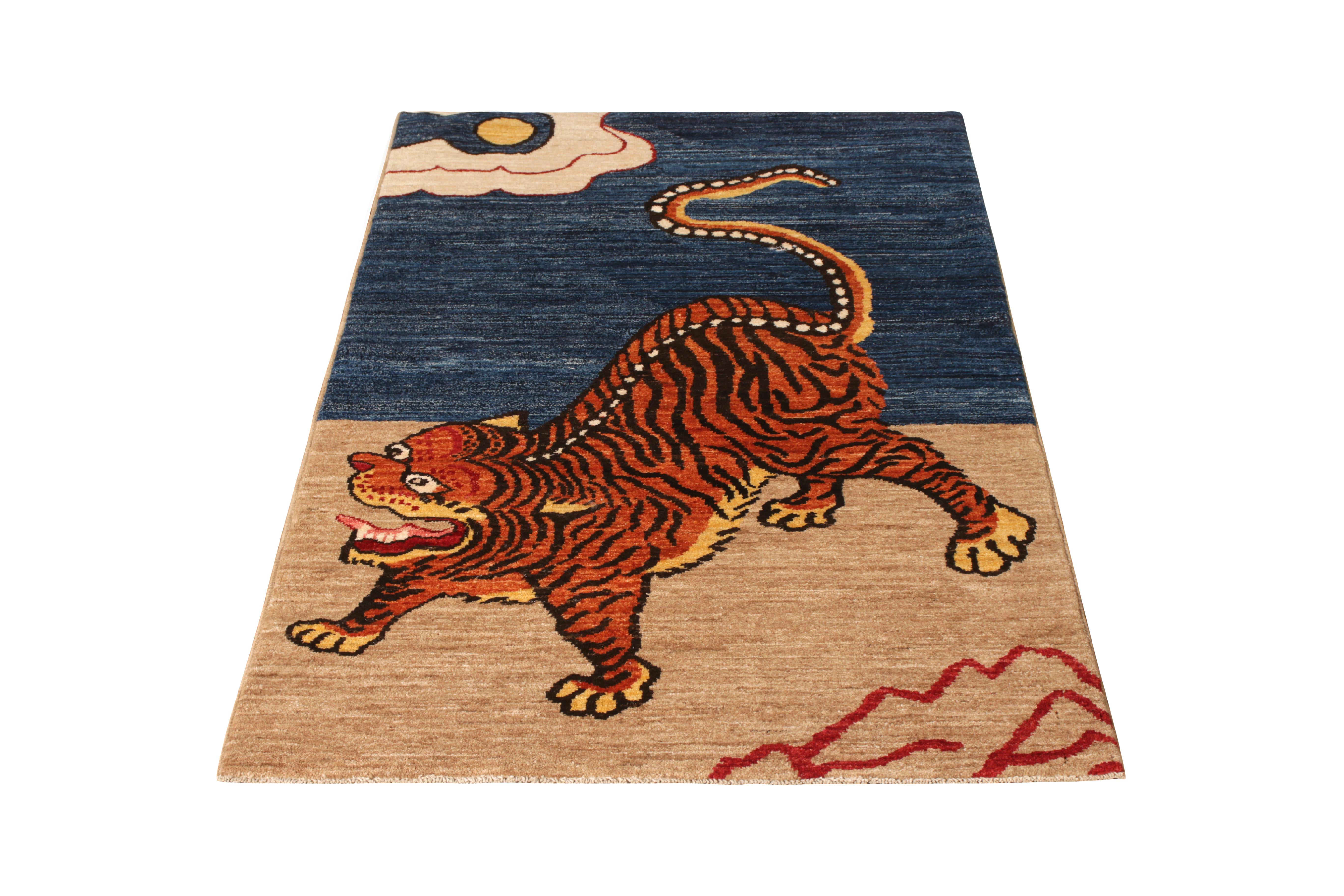 A 3 x 6 ode to celebrated Mongolian Tiger rug styles, from the latest collection by Rug & Kilim. Hand knotted in wool, depicting a twisting tiger in orange and black beneath the meeting of sky and earth in blue and beige. Enjoying our unique blend