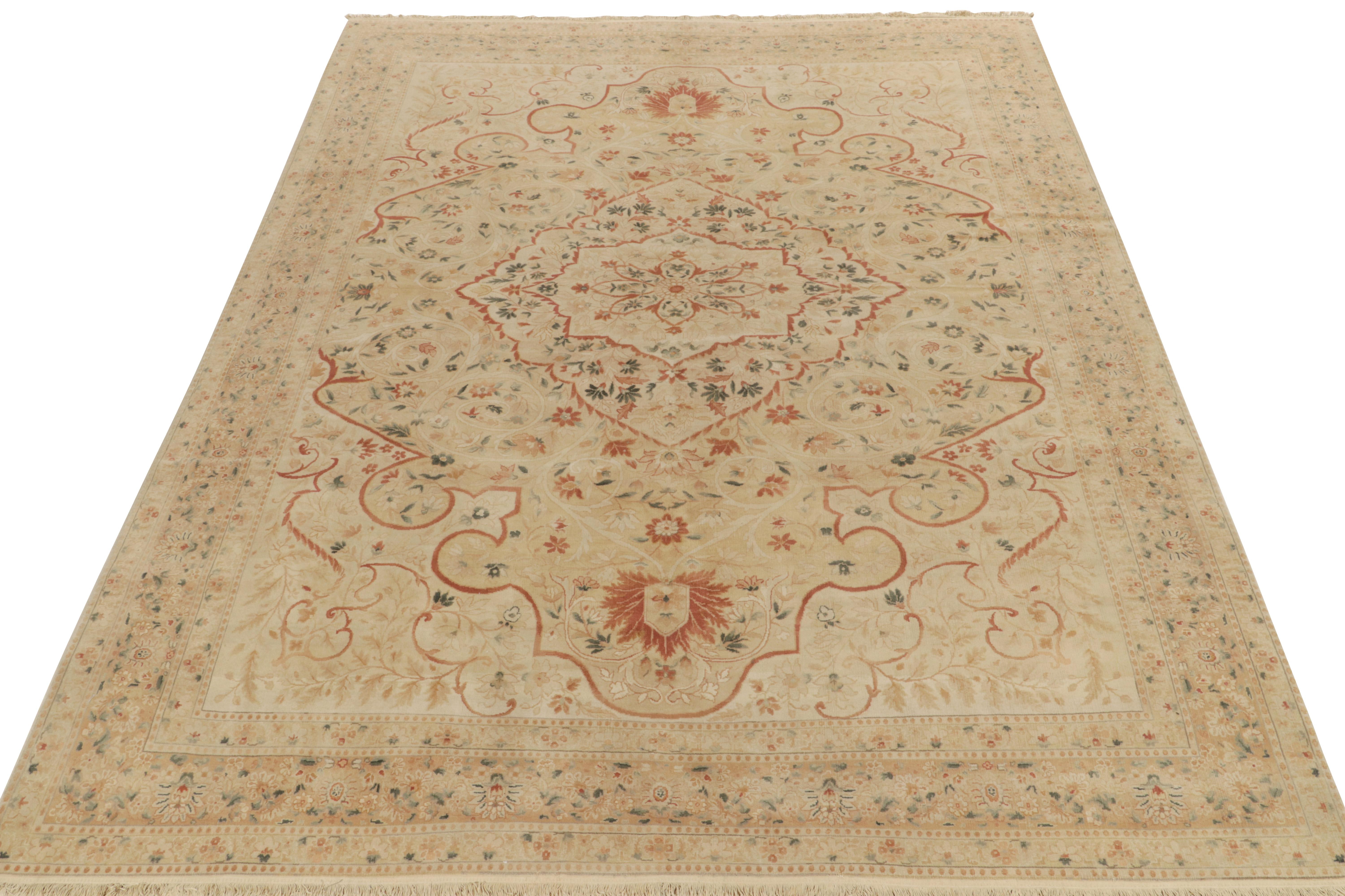 Marking an exquisite take on an antique Tabriz Persian rug style of the late 19th century is a 9x12 all wool rug from our Modern Classics collection. The hand-knotted creation reads a beautiful floral medallion pattern in beige, green & red-brown