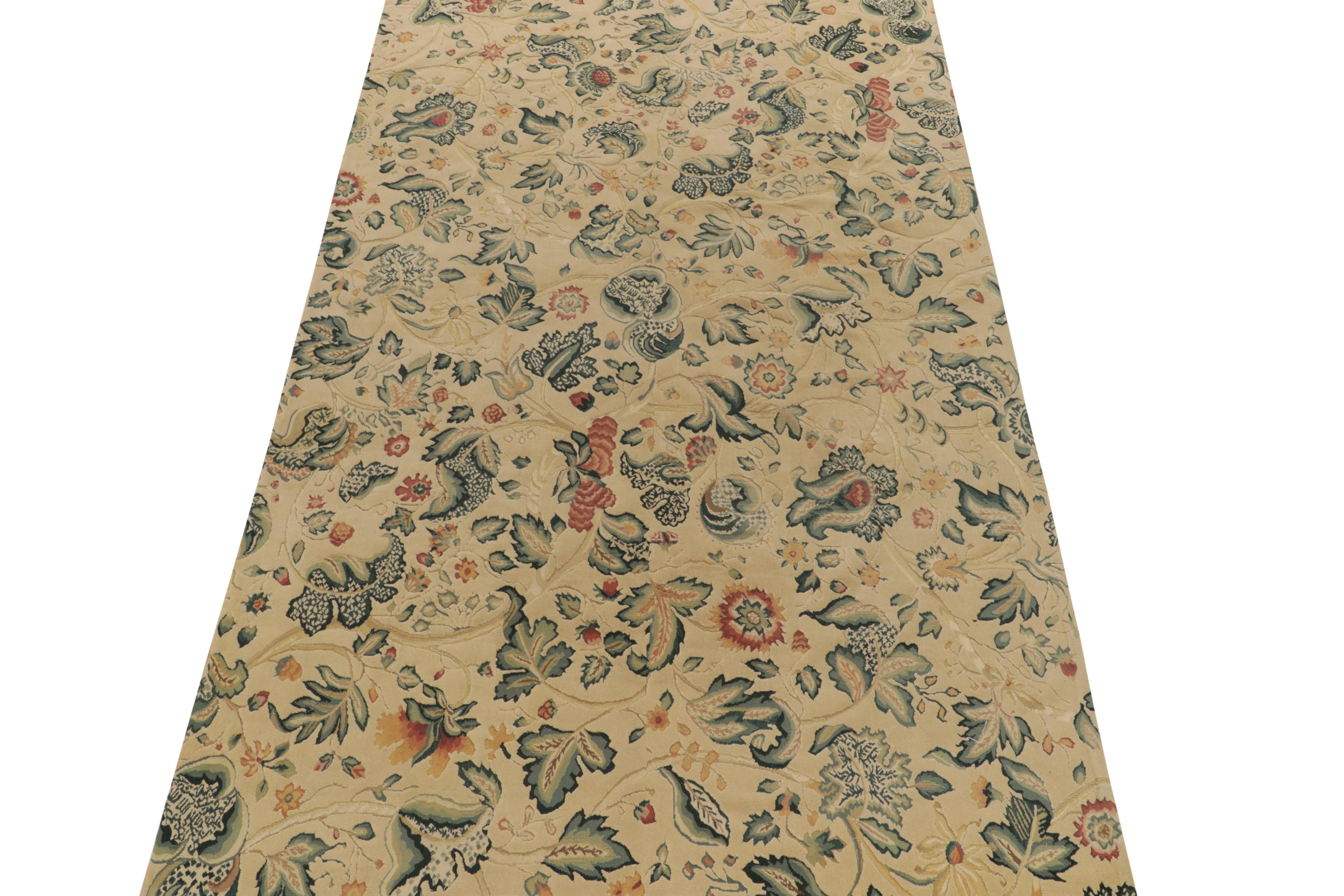 Connoting the Tudor style rugs of the 18th century, a 5x10 hand-knotted piece making way to our European collection. The rendering flourishes in gorgeous florals transitioning beautifully in green, gold & rich red on a luxe beige backdrop