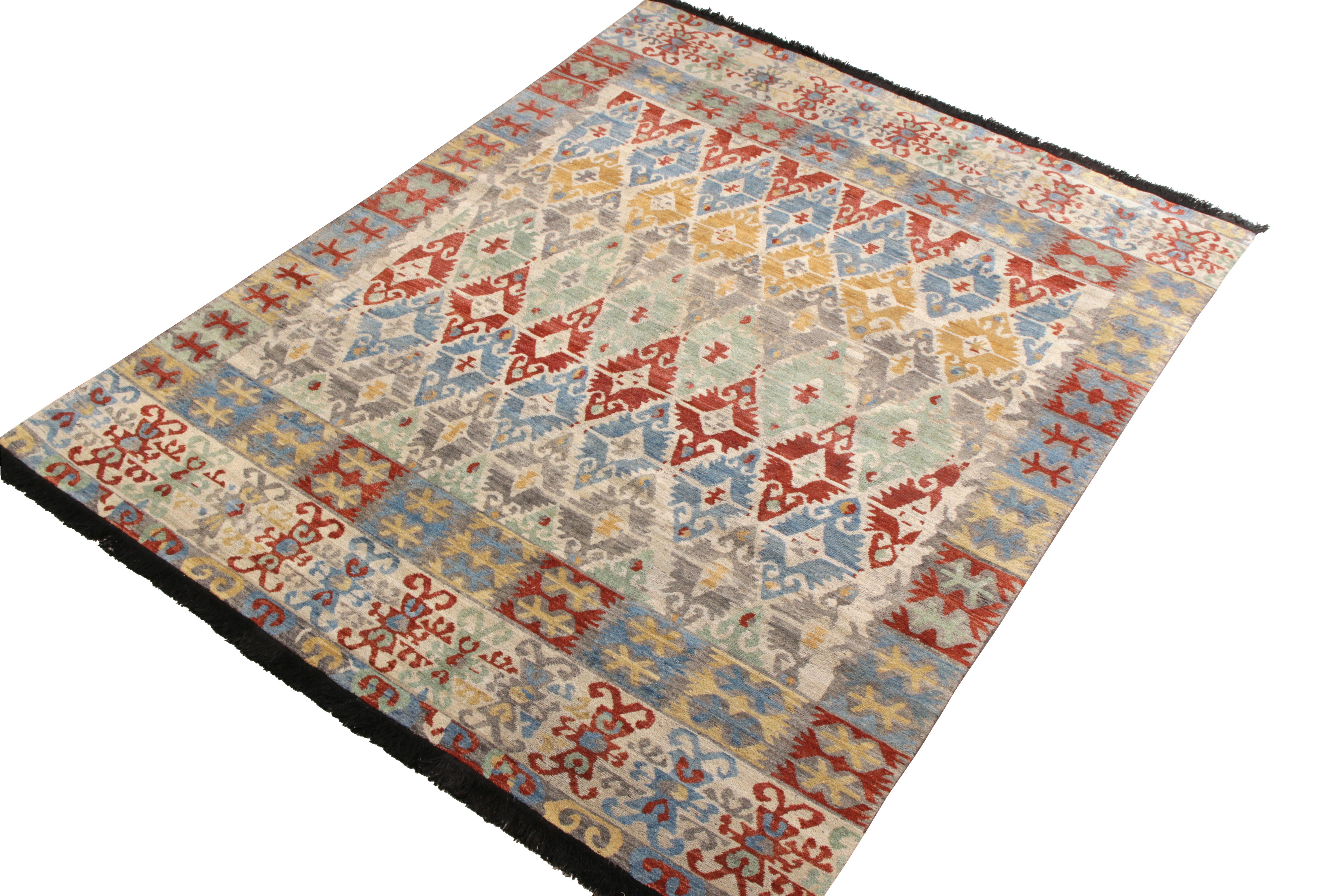 An 8 x 10 custom rug design paying homage to classic Kilim patterns, from Rug & Kilim’s Burano Collection. Hand knotted in soft Ghazni wool pile for a beautiful classic look with fresh and chic, lived-in colors. Prevailing gold, blue, and red with
