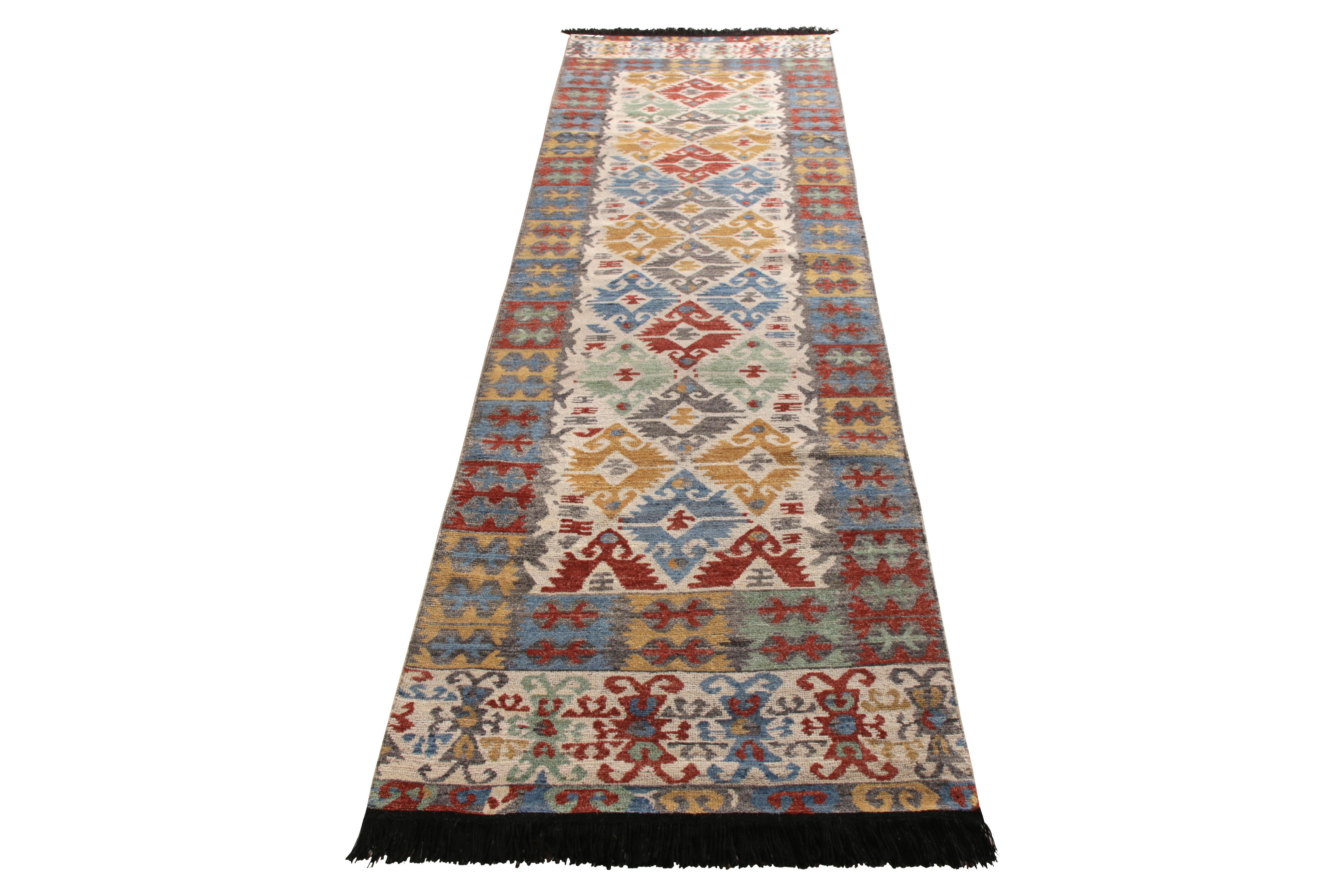 A 3x12 runner paying homage to classic Kilim patterns, from Rug & Kilim’s Burano Collection. Hand knotted in soft Ghazni wool pile for a beautiful classic look with fresh and chic, lived-in colors. Prevailing gold, blue, and red with beige-white