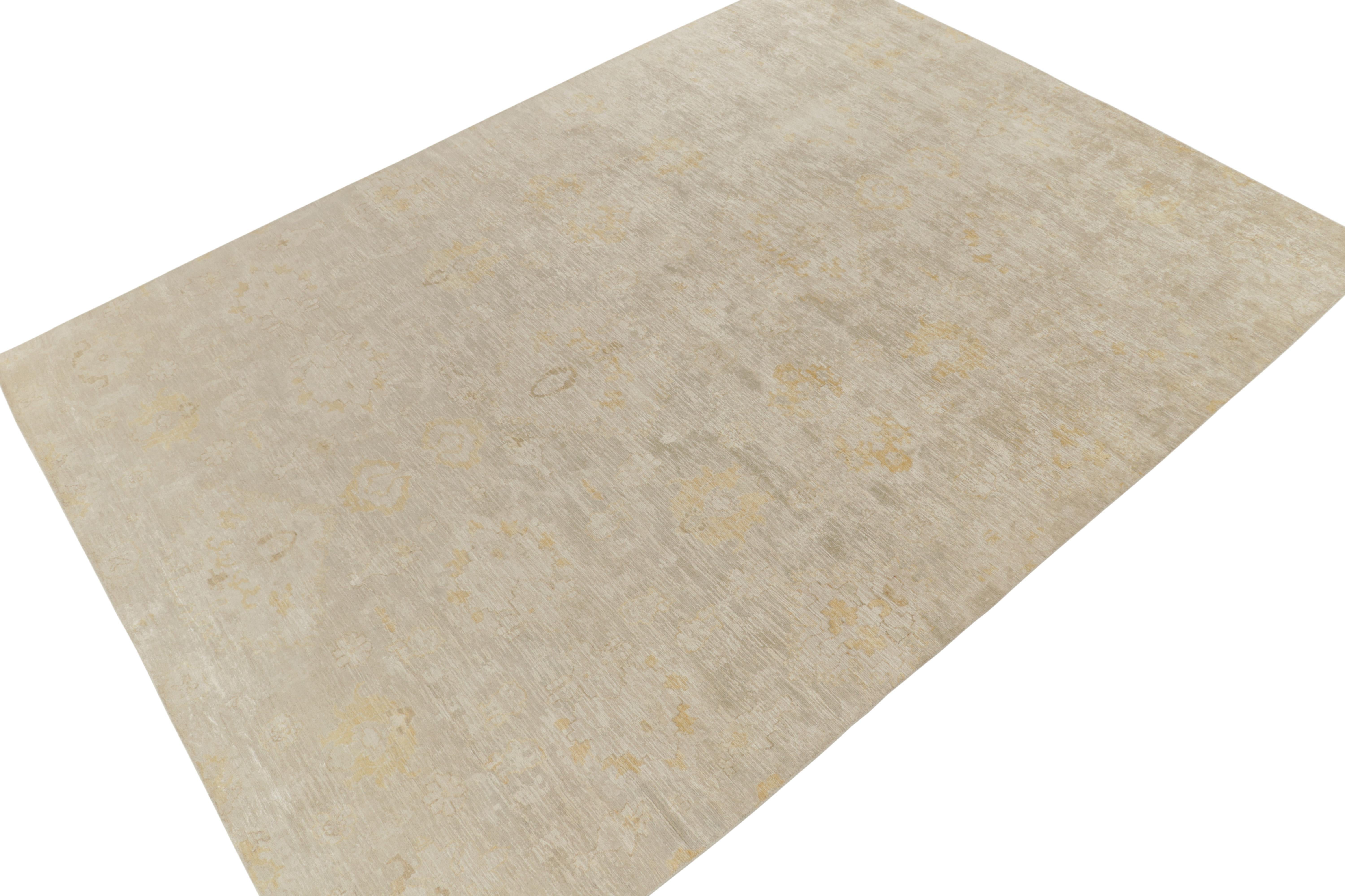 Hand-knotted in fine silk, a 10x14 abstract piece from Rug & Kilim’s contemporary selections uniquely inspired by classic floral pattersn. The alluring drawing presents itself with ivory and golden-yellow tones together to bring out a textural,