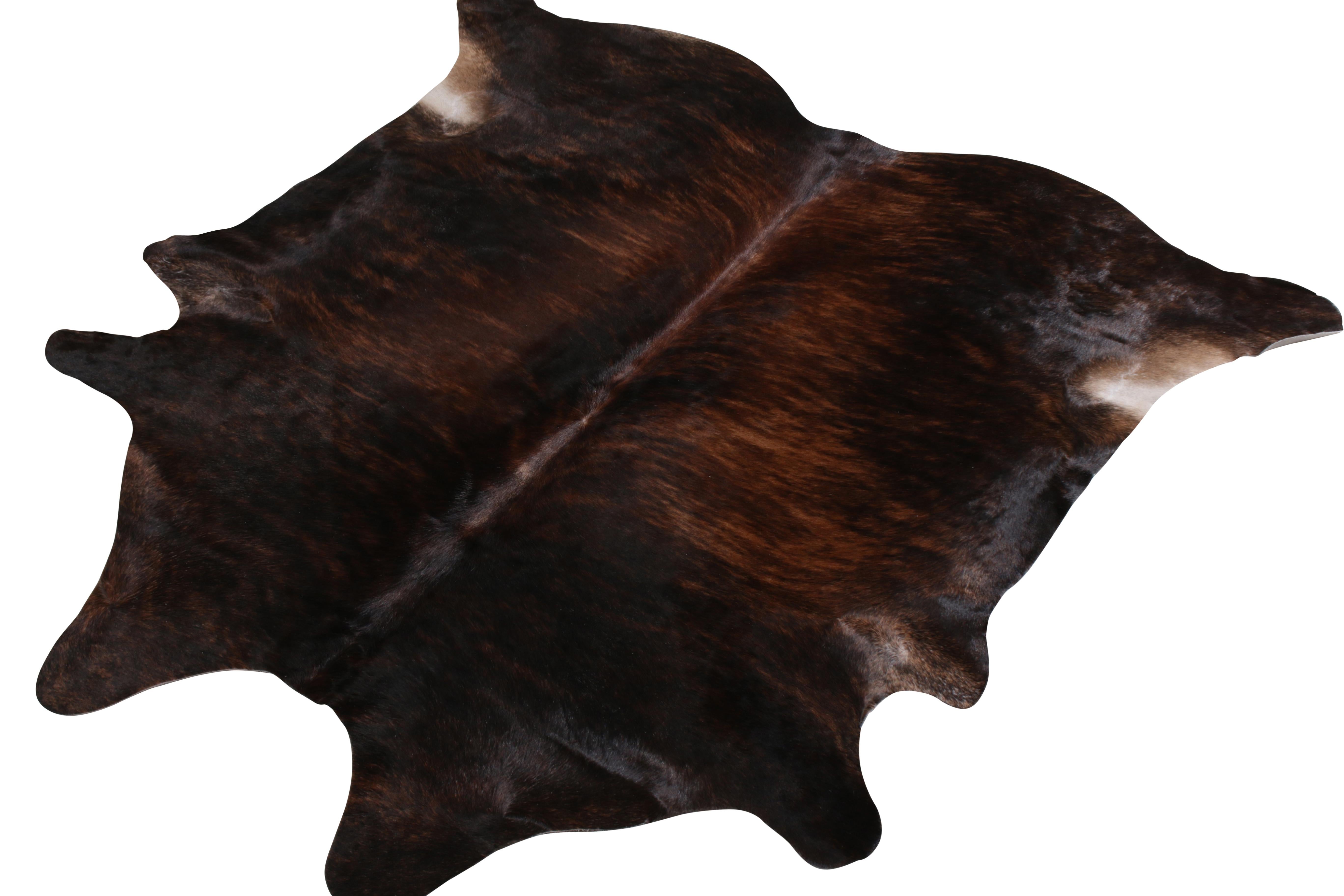 A 7 x 7 from Rug & Kilim’s line of handmade cowhide rugs. Enjoying a silky, lustrous sheen complementing rich beige-brown with black tones. A comfortable, textural choice, particularly well suited to country homes and rustic interiors.