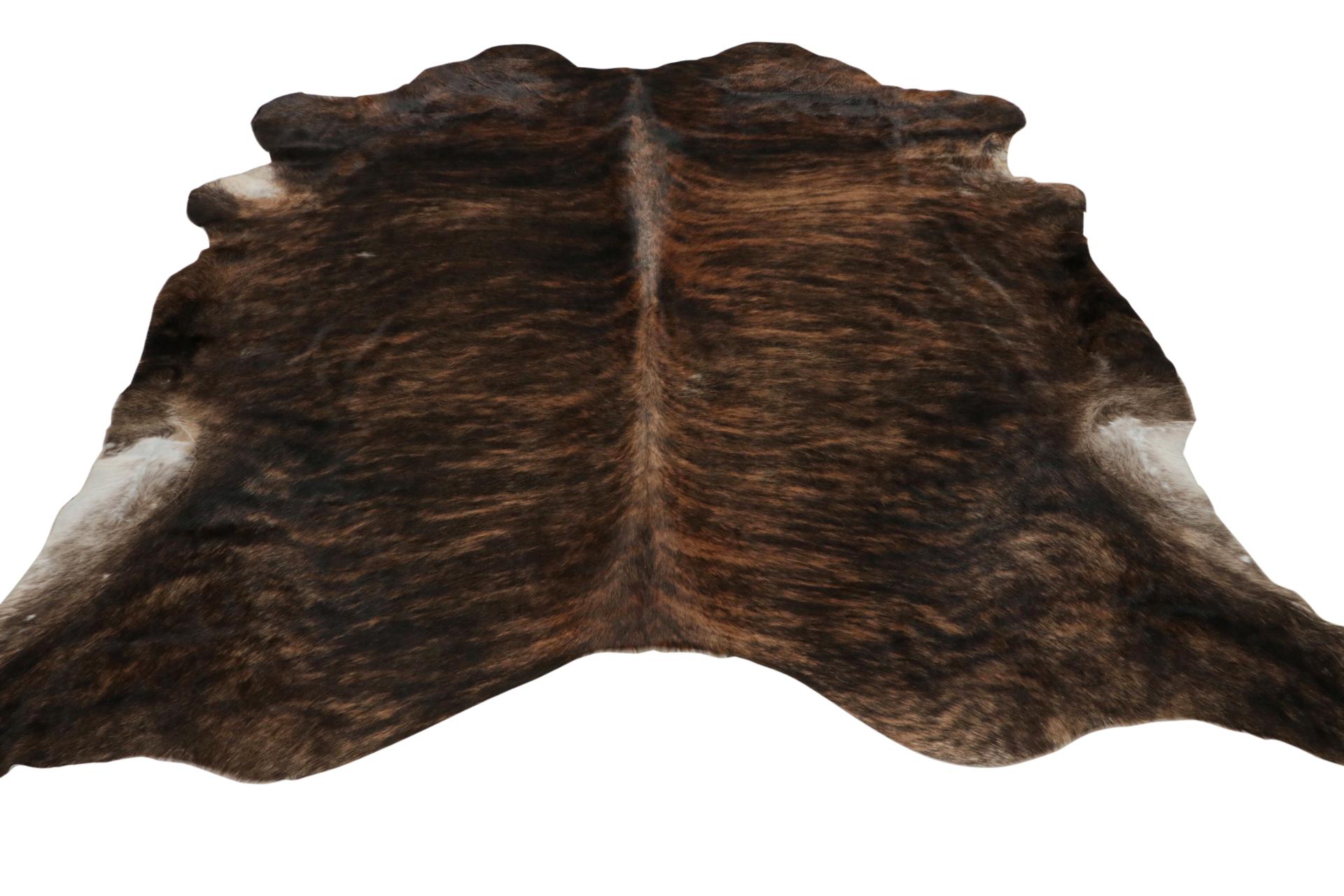 A 7x8 from Rug & Kilim’s line of handmade cowhide rugs. Enjoying a silky, lustrous sheen complementing rich beige-brown with black tones. A comfortable, textural choice, particularly well suited to country homes and rustic interiors.
