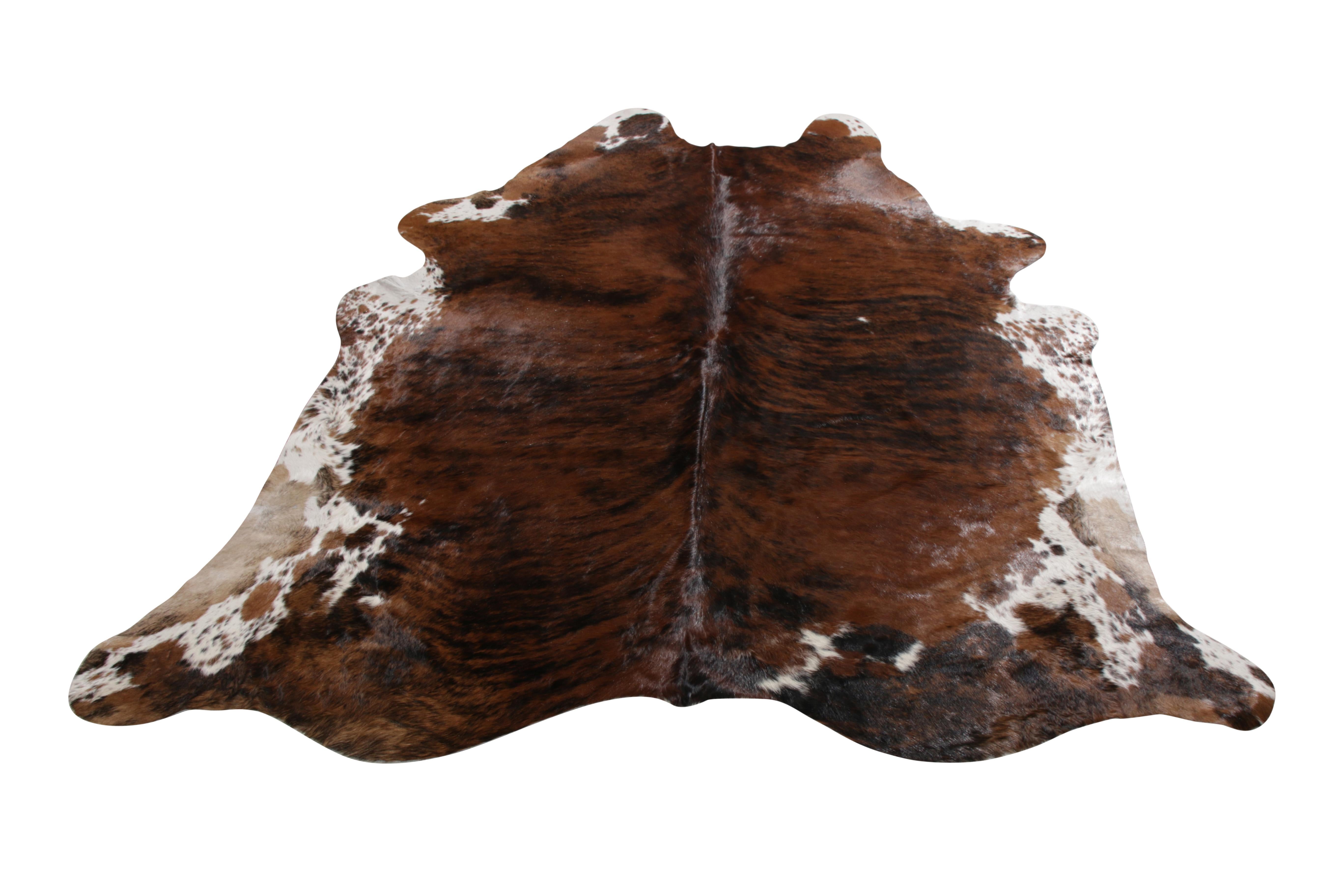 A 7 x 8 from Rug & Kilim’s line of handmade cowhide rugs. Enjoying a silky, lustrous sheen complementing the pallet of rich brown and forgiving white accents. A comfortable, textural choice, particularly well suited to country homes and rustic